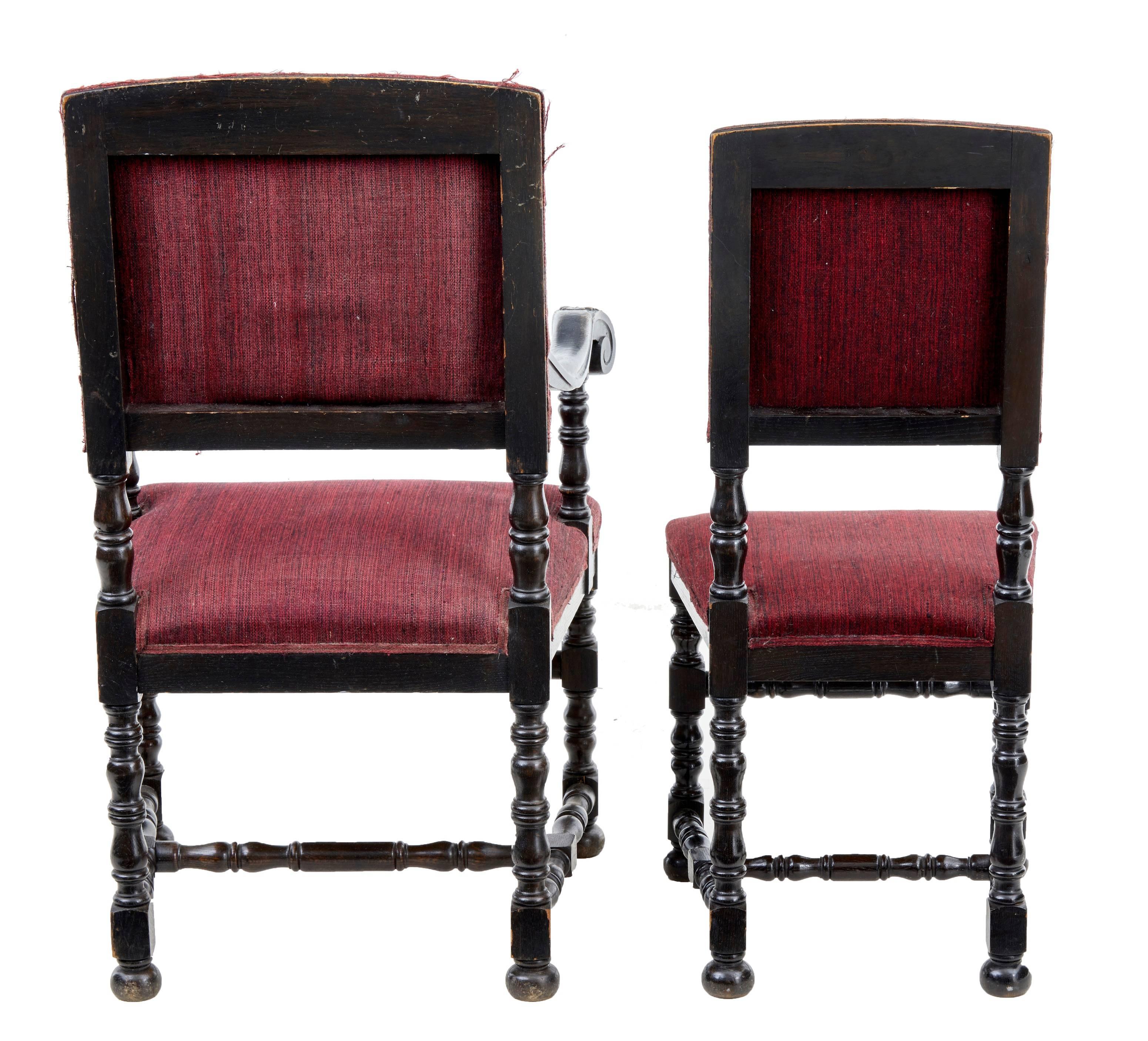 Carved Set of Ten and Two Early 20th Century Baroque Influenced Oak Dining Chairs