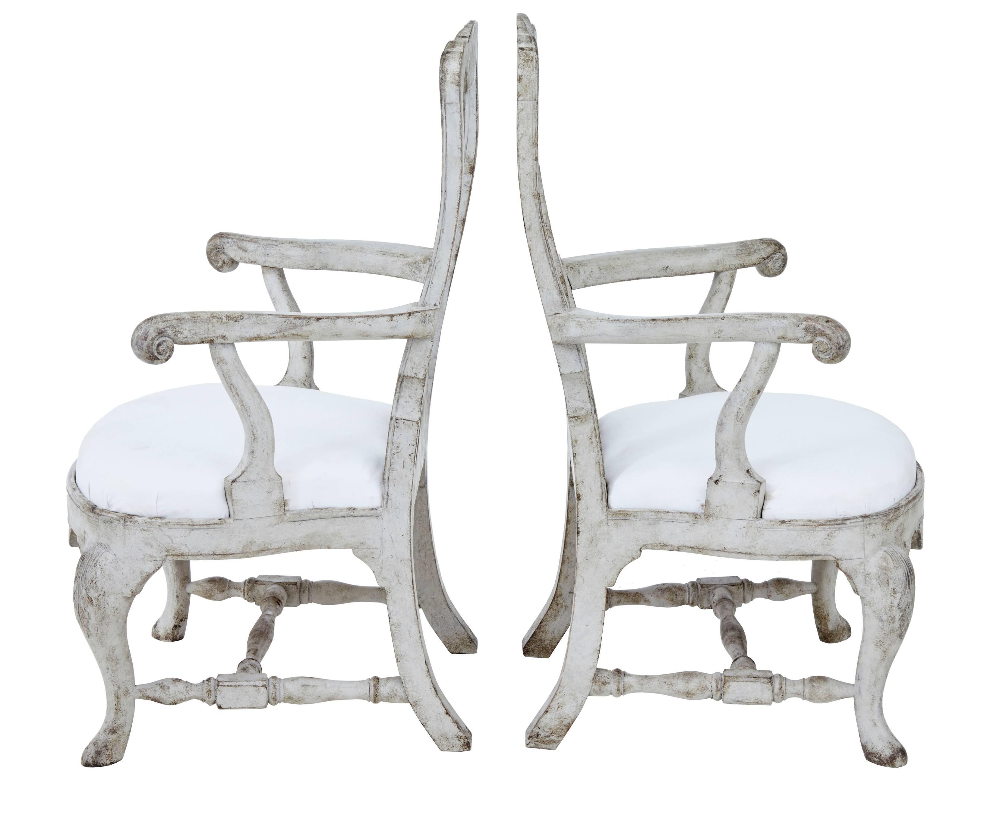 Fine quality pair of Gustavian inspired armchairs, circa 1860.
Carved with shells to the back and front rail and acanthus leaf to the leg.
Scrolling arms.
Drop in seats ready for re-covering.
Later paint which has now taken on a weathered