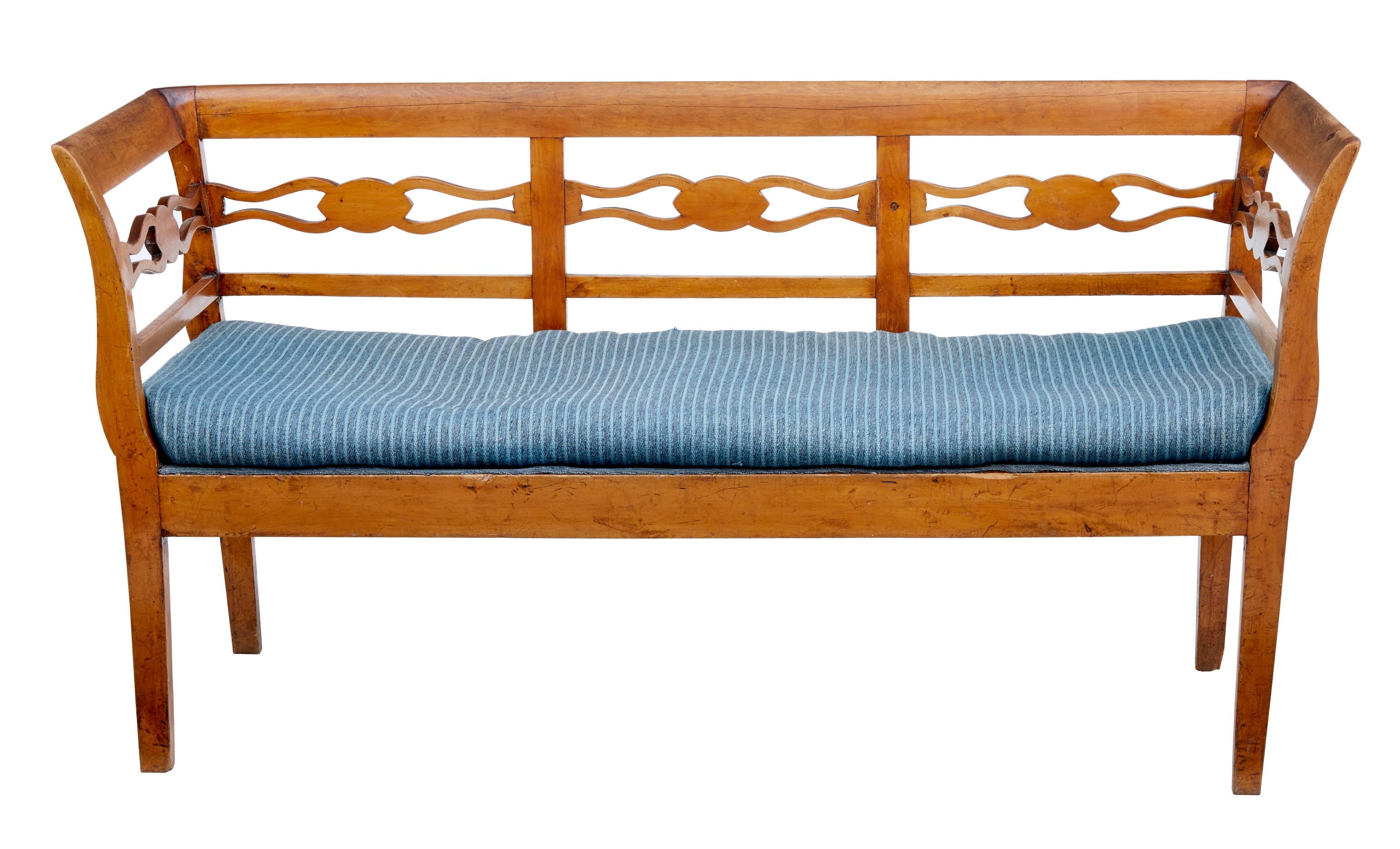Small Swedish pine bench, circa 1870.
Open fretwork detail to the back and arms.
Original seat cushion.
Good color and patina.
Some surface marks to wood work.



Measures: Height 30 1/2