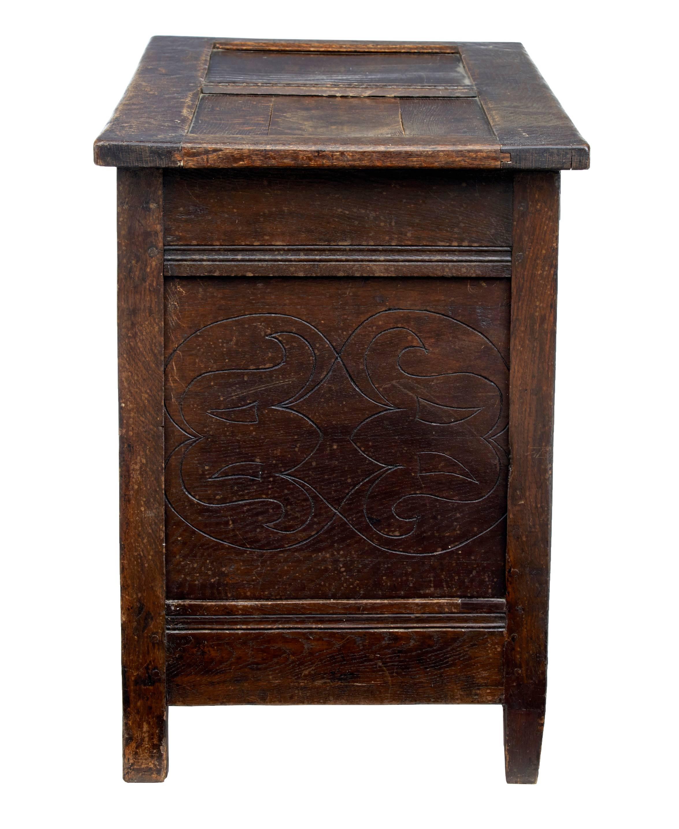Good quality carved oak coffer circa 1680.
Fine quality carved front with scrolls and reeding.
2 fielded panel top.
Good color and patina.
Later hinges and expected surface marks with age.

Height: 27 3/4"
Width: 42 1/2"
Depth: 20"