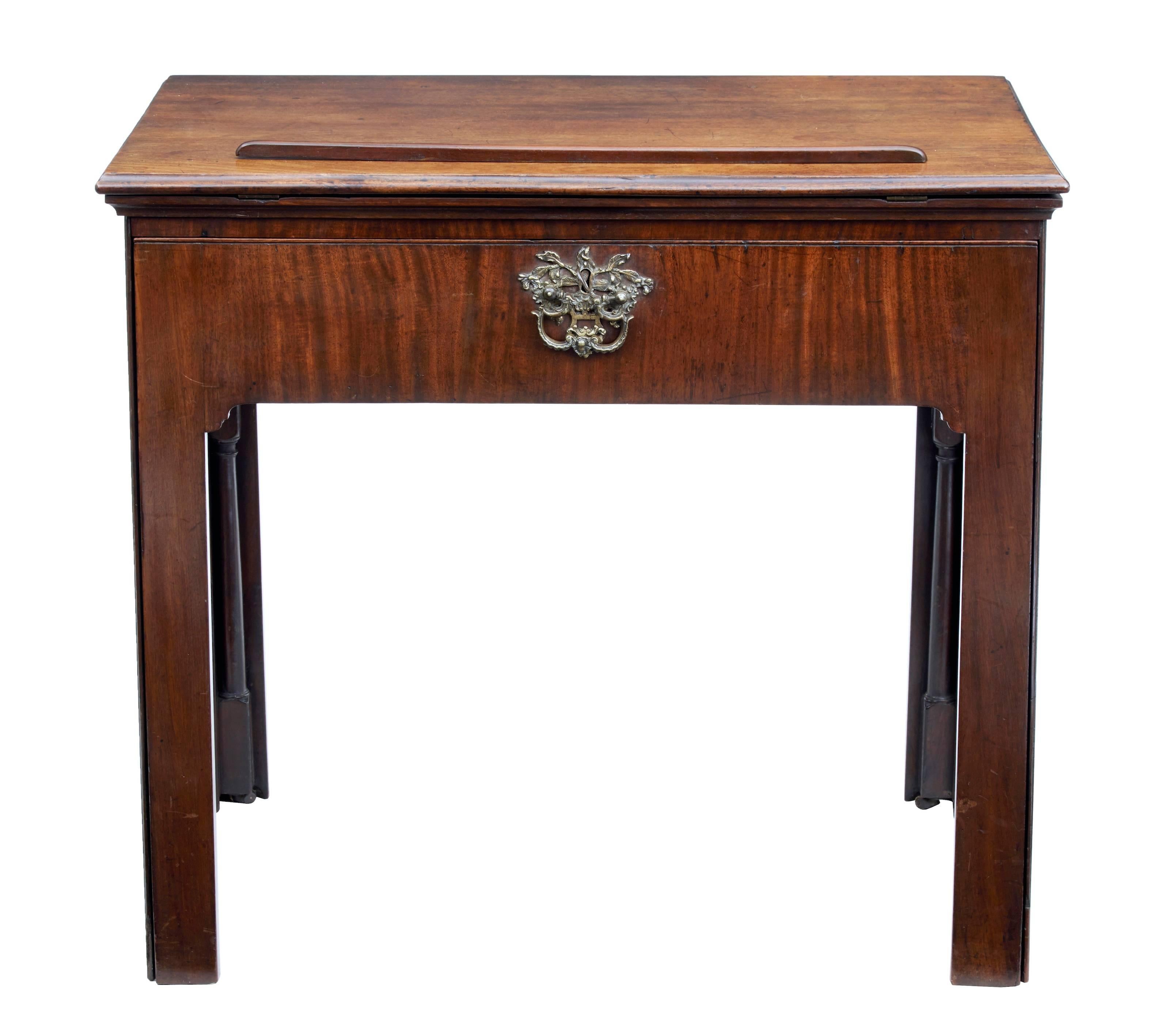 Stunning Georgian period mahogany architects desk, circa 1790.
Quality piece of Georgian furniture.
Hidden front pulls out to reveal velvet writing surface. With concealed flip out ink well and tray.
Smooth action metamorphic architects drawing