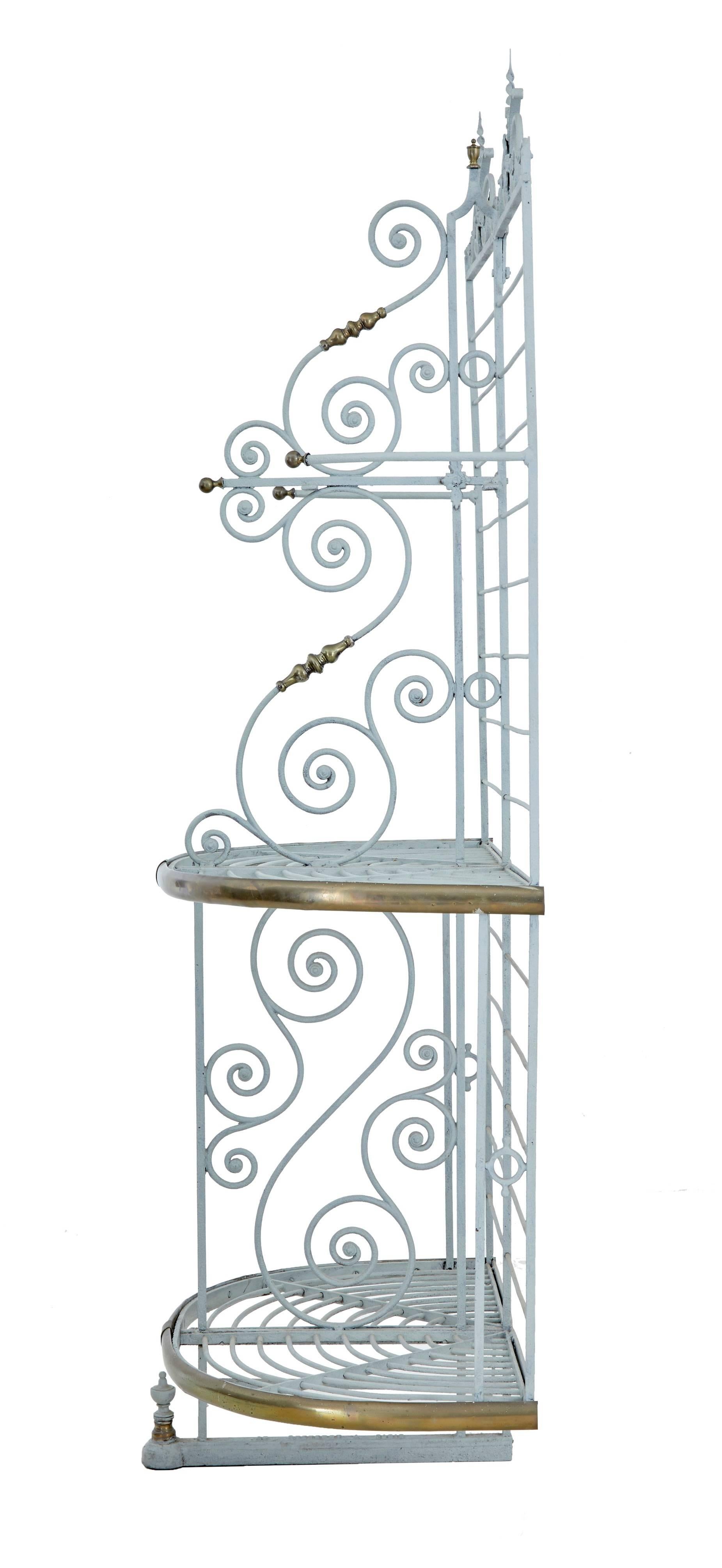 Small quality boulangerie baguette rack
Made from iron with various detailing such as twists and monkey tails.
Possibly adapted from a larger piece.
Decorated with brass turnings and finials.
Stamped with a Paris maker on the base. Later