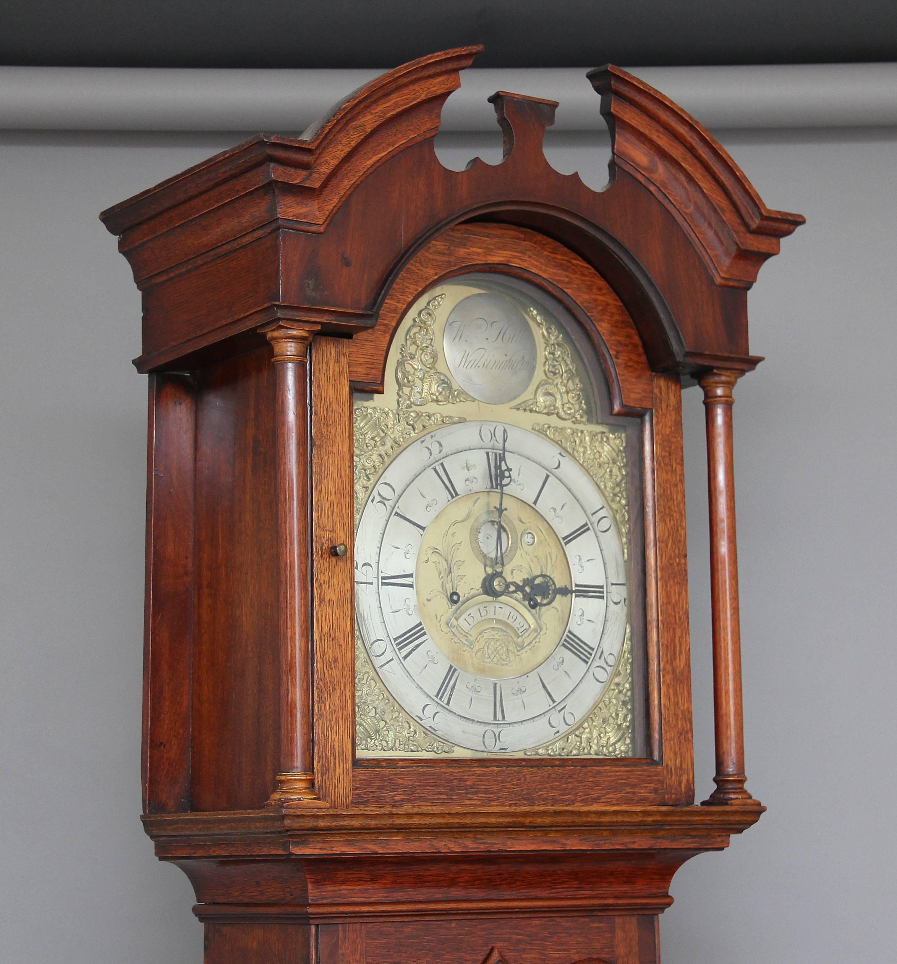 A very fine 18th Century oak eight day long case clock by William Hill of Walsingham (Norfolk), circa 1760. The brass dial of this clock is most interesting and features a “penny moon” where one would normally expect a seconds ring, a conventional