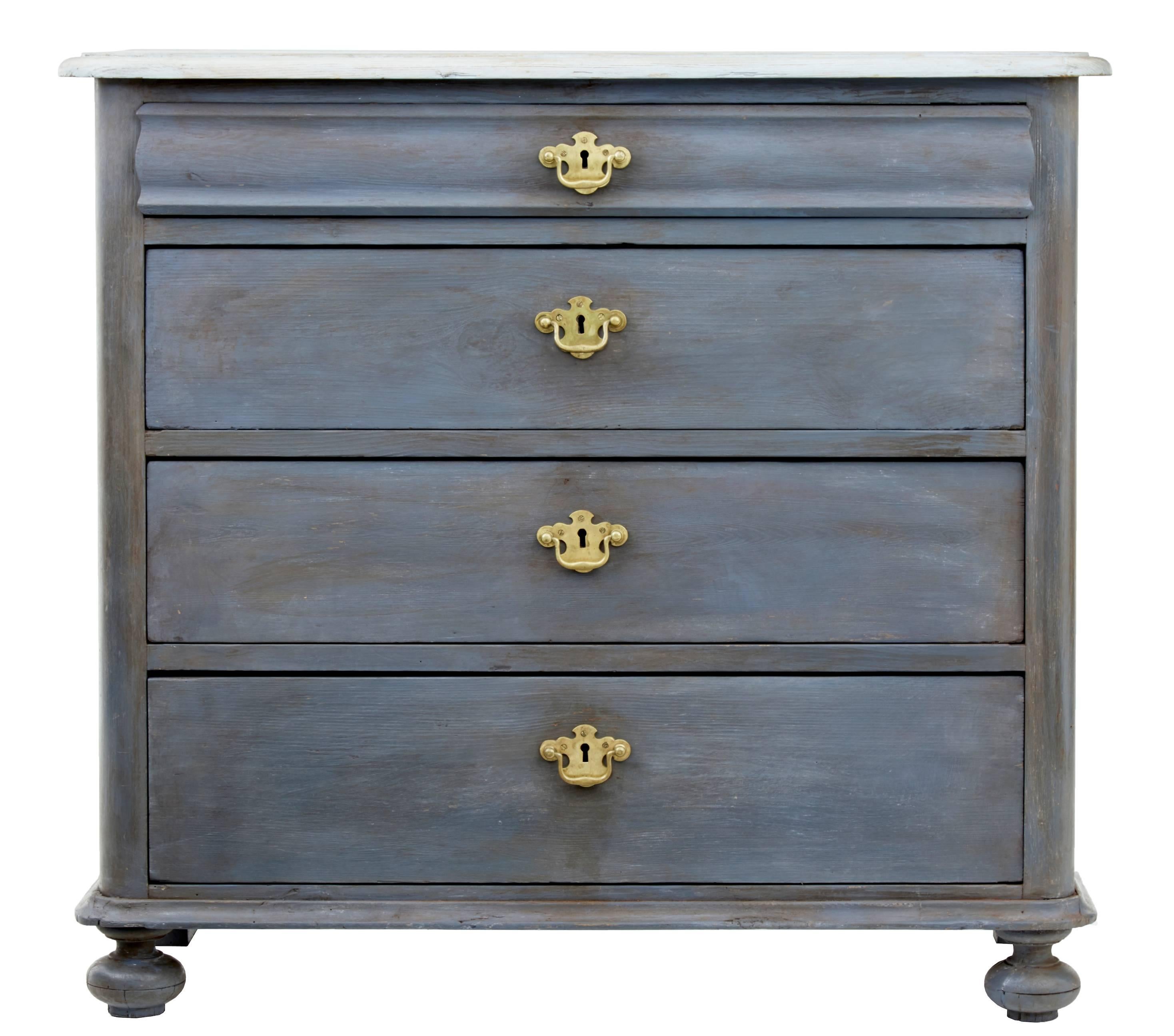 Danish four-drawer commode, circa 1870.
Shaped top drawer with a further three graduating drawers with later brass handles.
Later weathered paint, with contrasting off-white top.
Bun feet to the front with block feet to the back.

Measure: