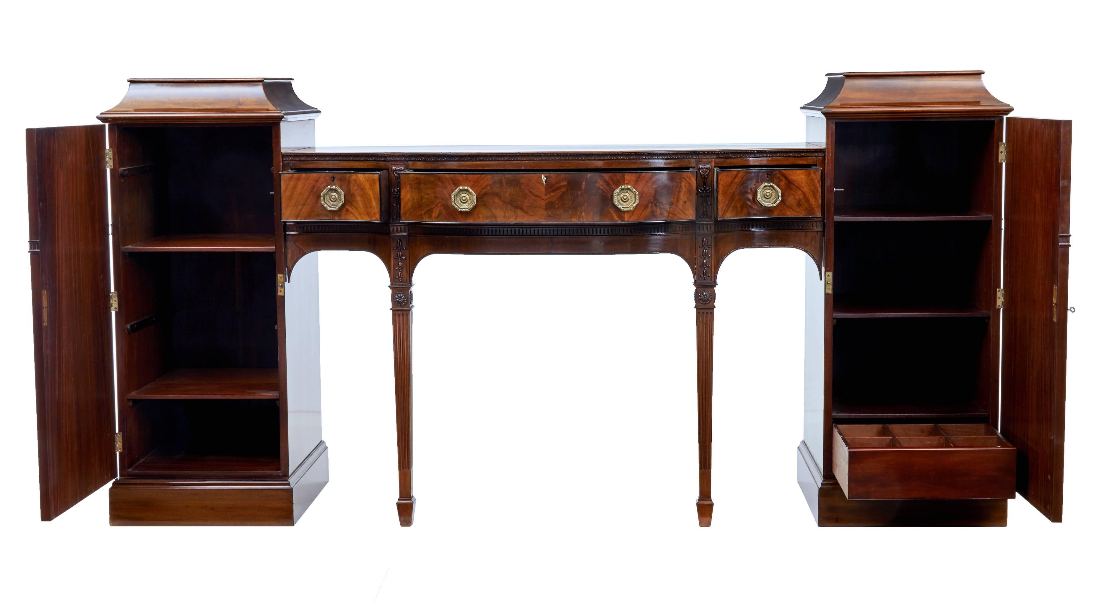 Fine quality English mahogany pedestal sideboard, circa 1880.
Comprising of three parts which fit together with dowel and screw.
Carved and decorated with applied swags and florals in the Adams style.
Right hand pedestal with two shelves and a