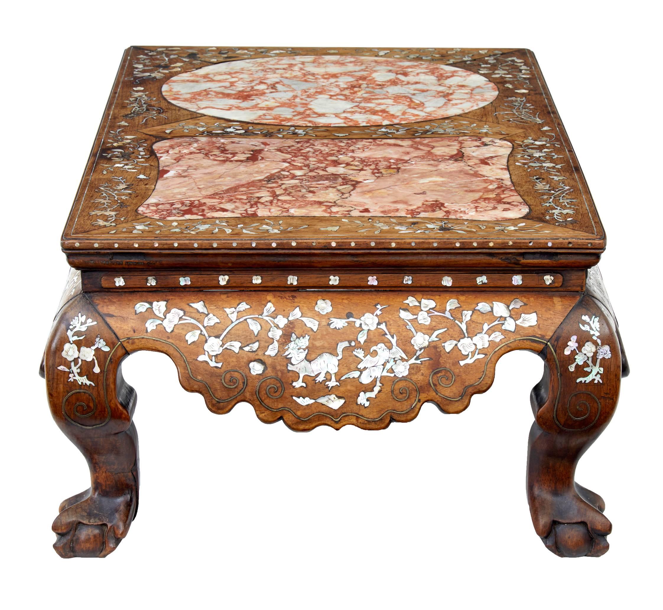 Mid Qing dynasty huanghuali inlaid Kang table, circa 1780.
Given the marble inserts we believe this table was used for dining purposes.
Profusely inlaid with mother-of-pearl rams, dogs and birds and surrounded by patterned florals.
Further inlaid