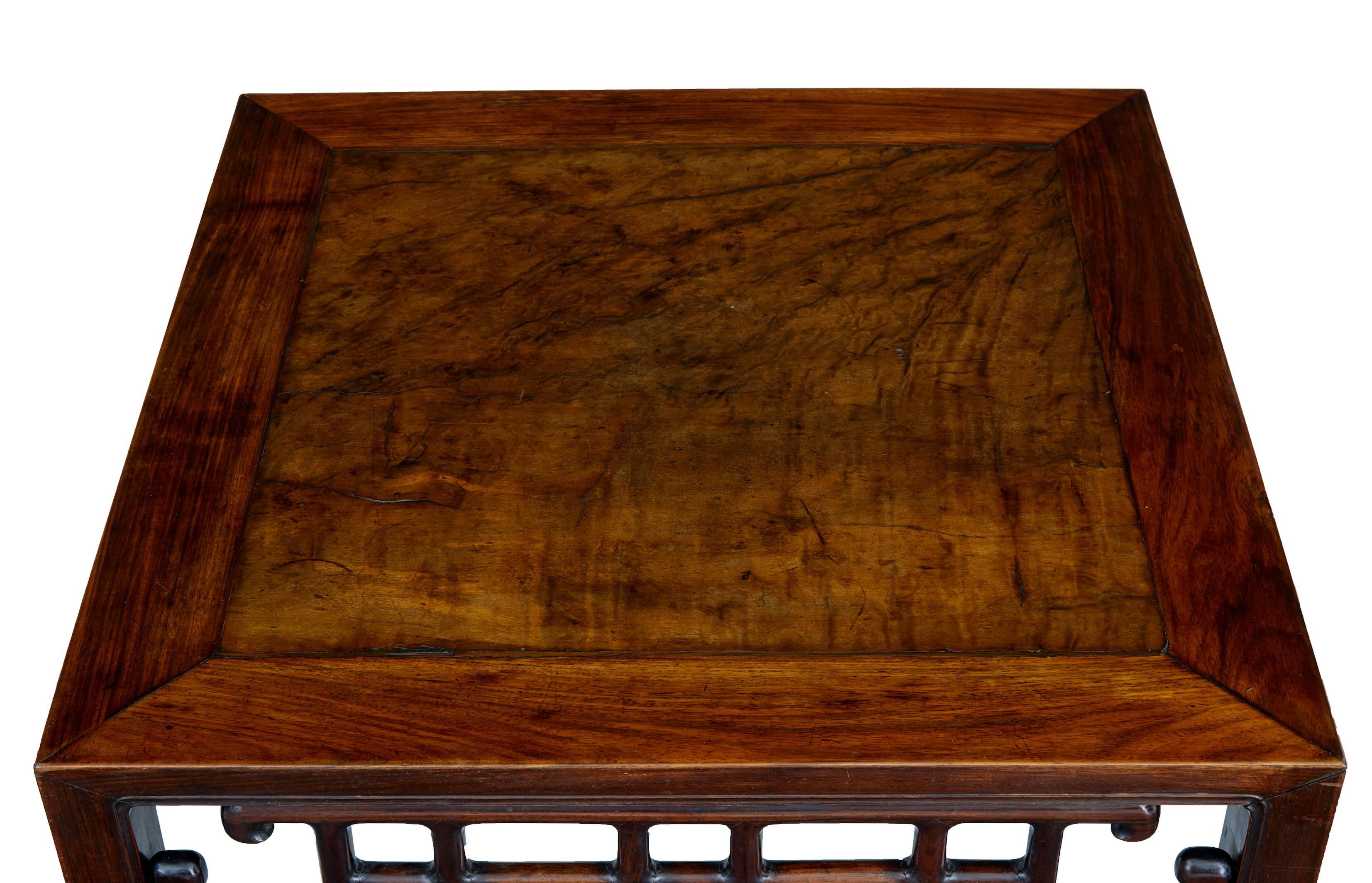 Excellent example of a kang table made from Huanghuali wood, circa 1810. Burr wood central insert. Feet are joined separately which was normal practice as these were typically made from off cuts of wood to cut down on the amounts of precious wood
