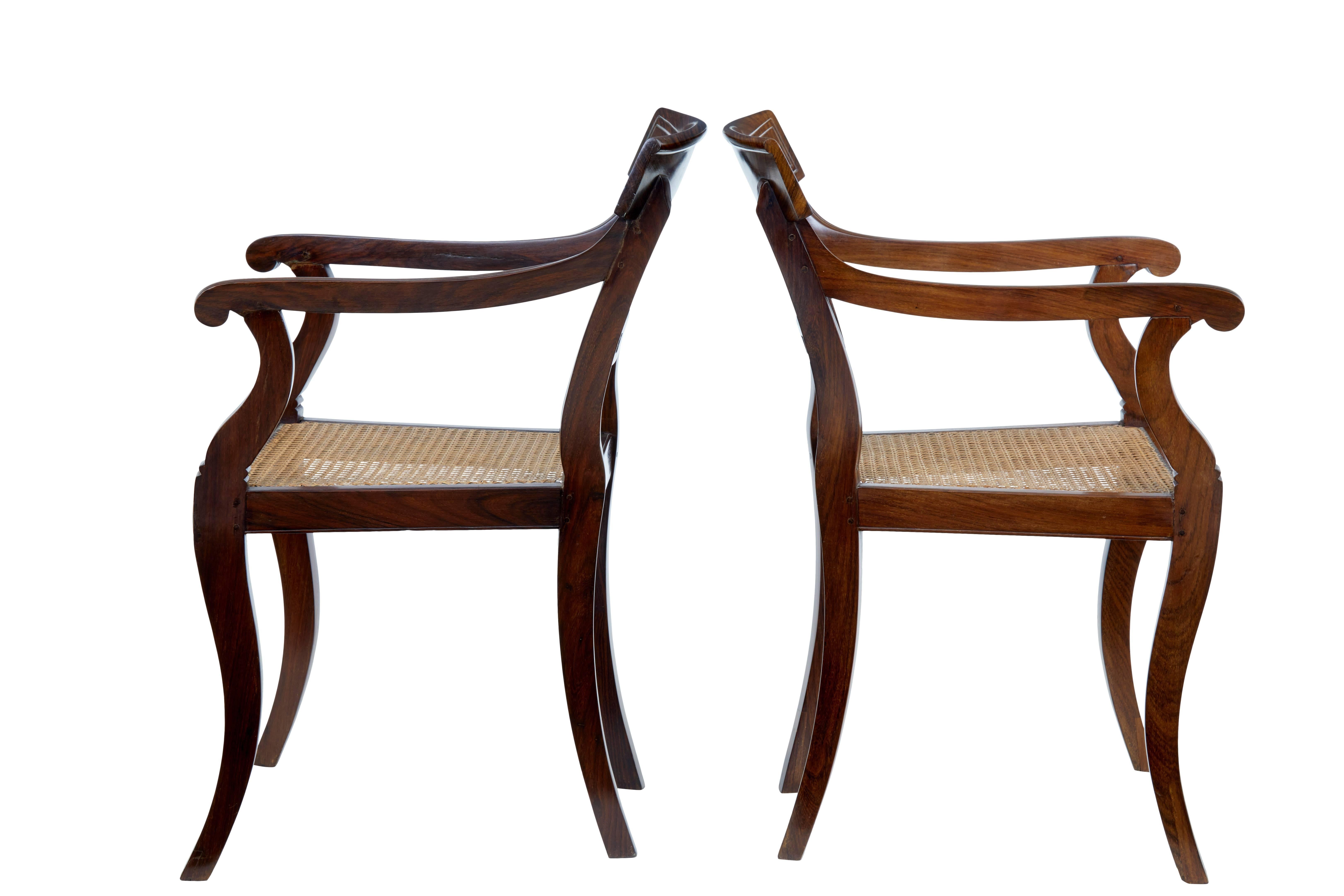 Fine pair of Chinese export armchairs, circa 1820.

Made in the Regency style for the export market. Solid Huanghuali wood. Reference to these chairs can be found in the book The China Trade, page 251, plate 134 by Carl L Crossman.

1 inch