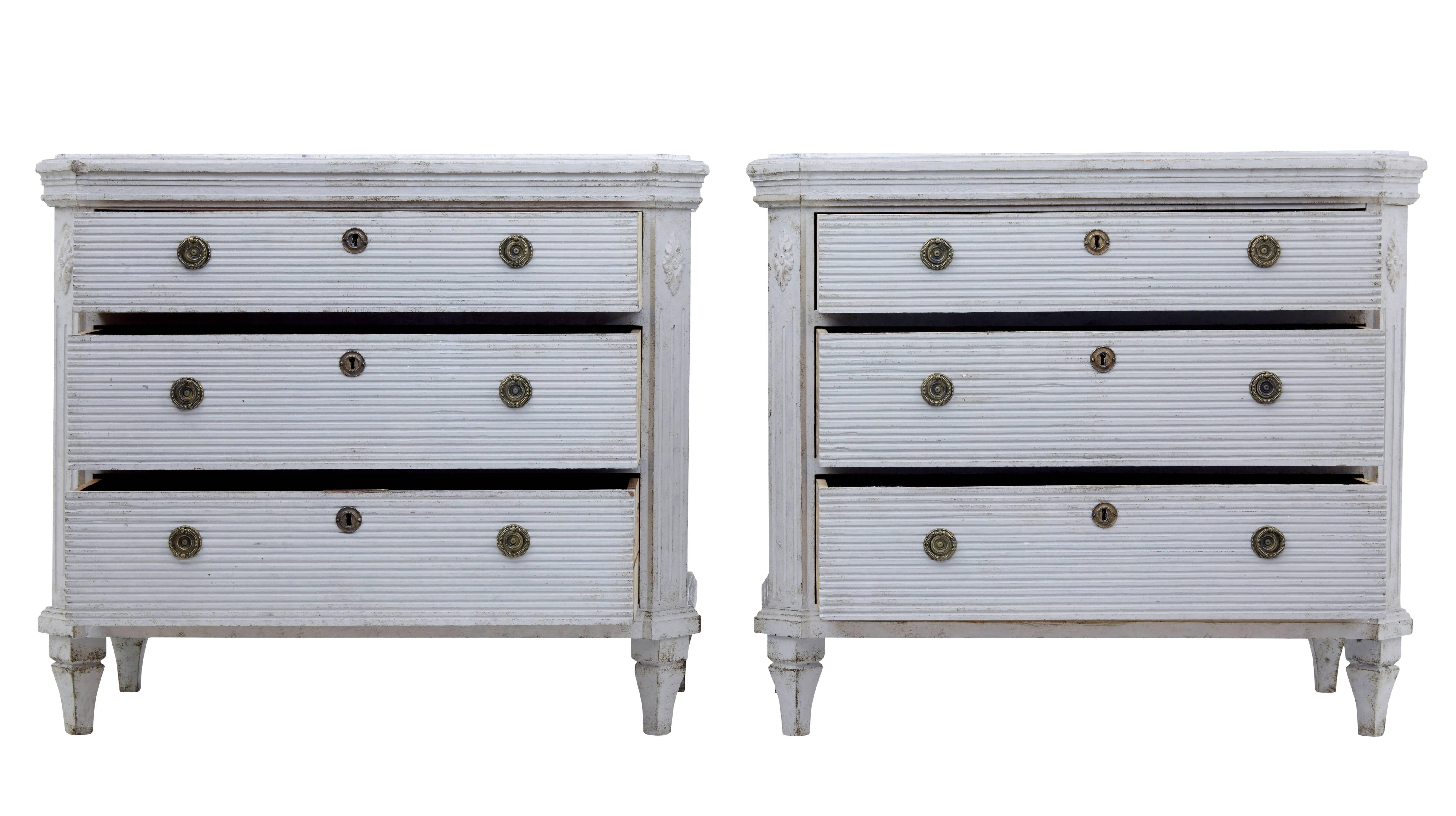 Fine pair of Gustavian influenced Swedish commodes, circa 1860.
Three drawers with fluted detailing to the front. Later brass ring handles.
Faux marble painted top. Later paint.
Measures: Height 30 1/4