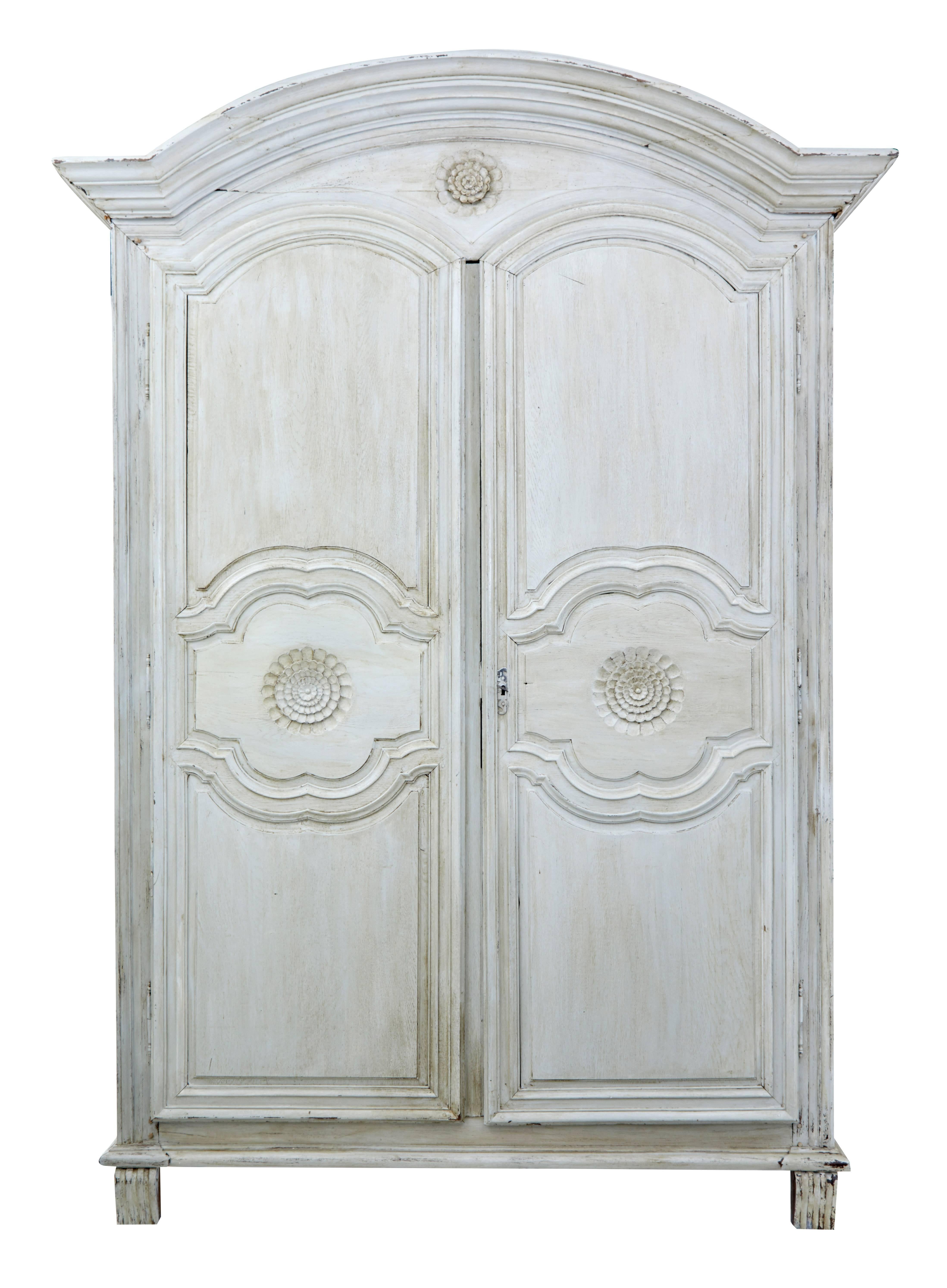 Large and impressive French armoire, circa 1810.
Double door fronted, which opens to a semi fitted interior of two drawers and two shelves.
Removable cornice.
Due to the peg construction of this armoire it can be fully flat packed for shipping
