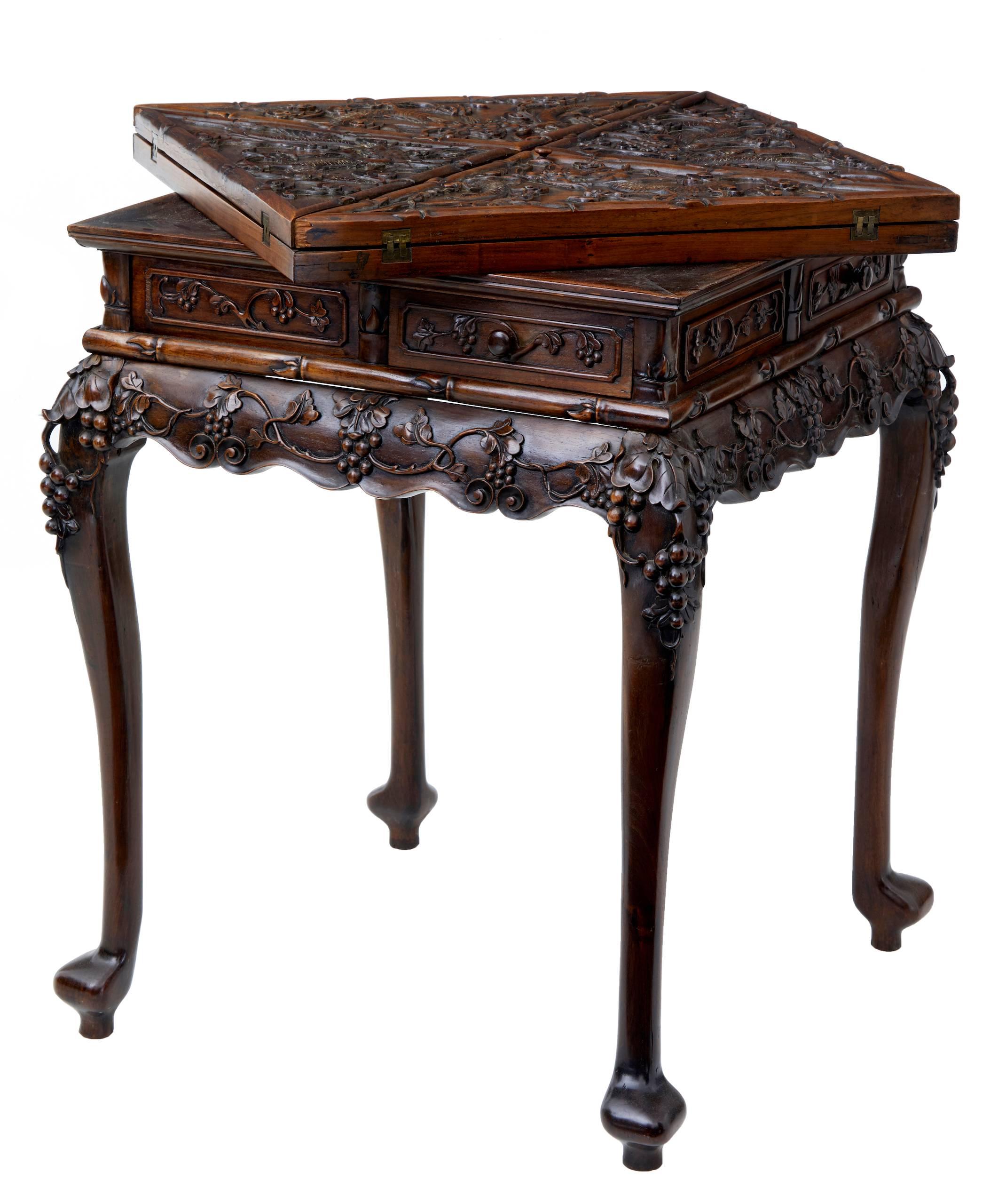 Superb quality Chinese games table, circa 1890.

Beautifully carved in no expense spared huanghuali wood. Envelope top opens to reveal a later green baize playing surface. Reverse of top with further carving and wells.
Single drawer on each