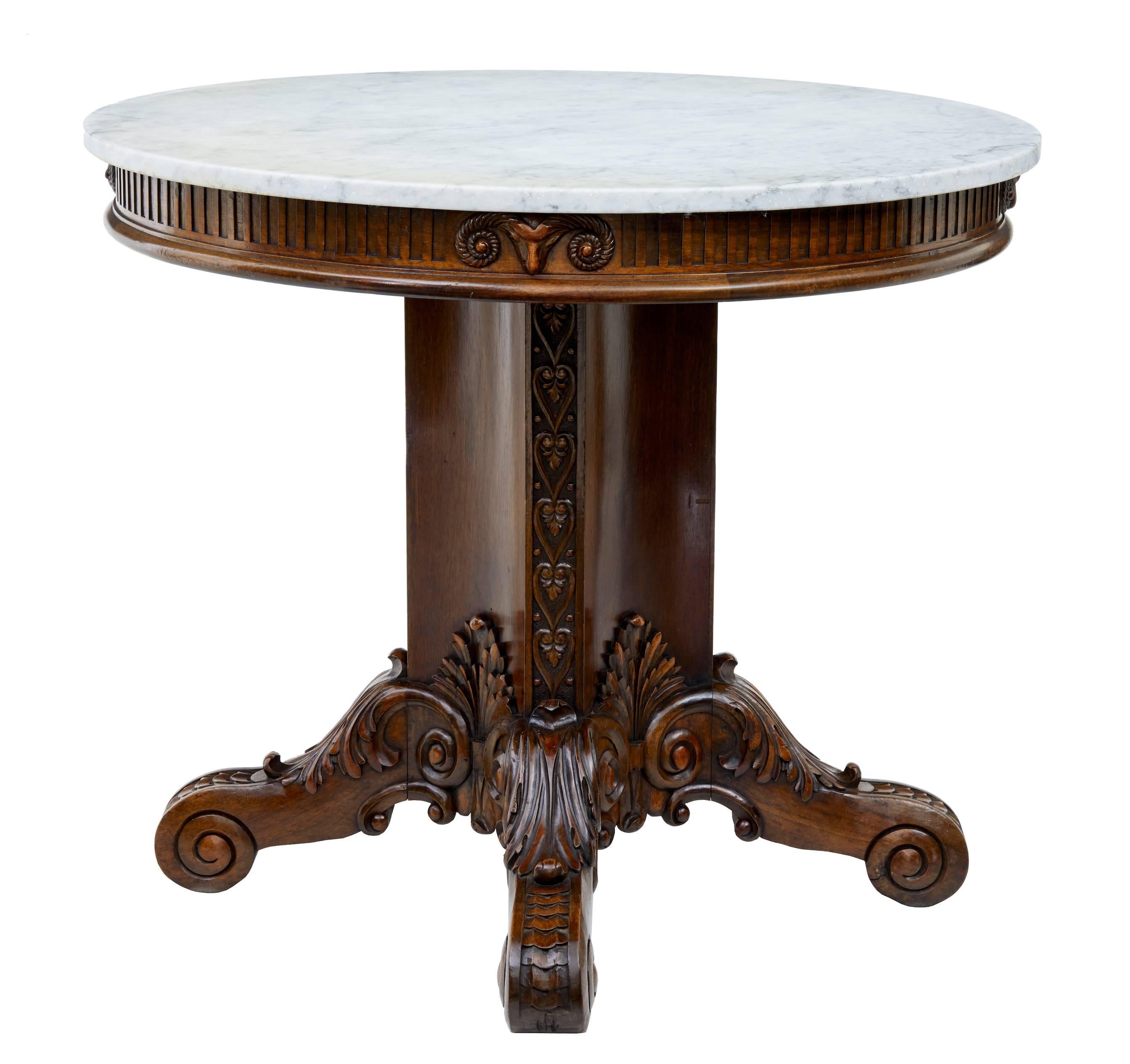 Beautifully carved walnut gueridon table, circa 1870.

Circular marble-top.
Superbly carved around the frieze with rams heads on the quarter.
Concaved shaped stem with heart carving.
Standing on four scrolled legs with acanthus leaf