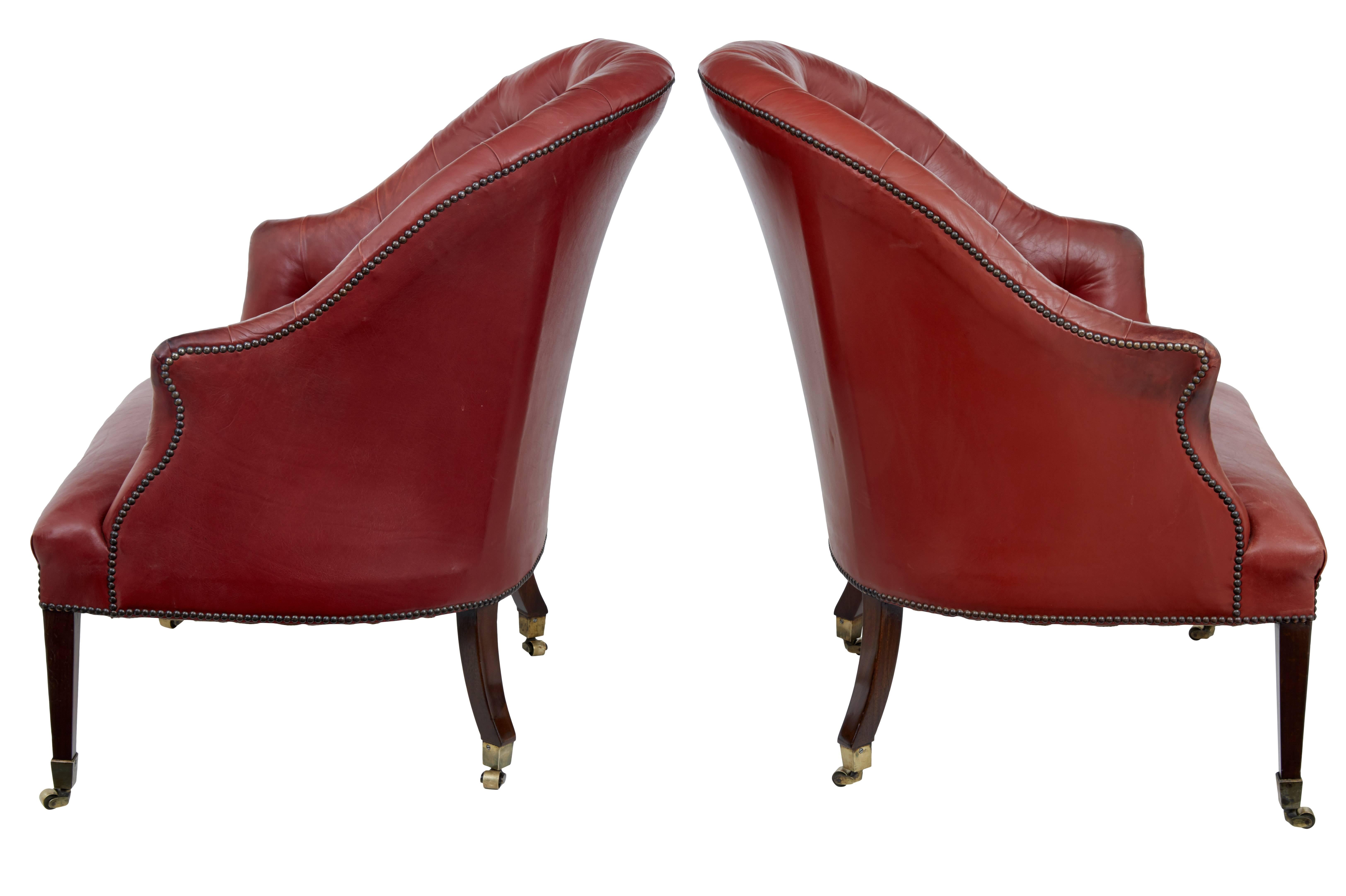 Fine quality pair of late 19th century leather lounge chairs, circa 1895

Excellent quality original button back red leather which is in fine condition for its age.
Superb proportions on these chairs, which have a wide seat.
Standing on mahogany