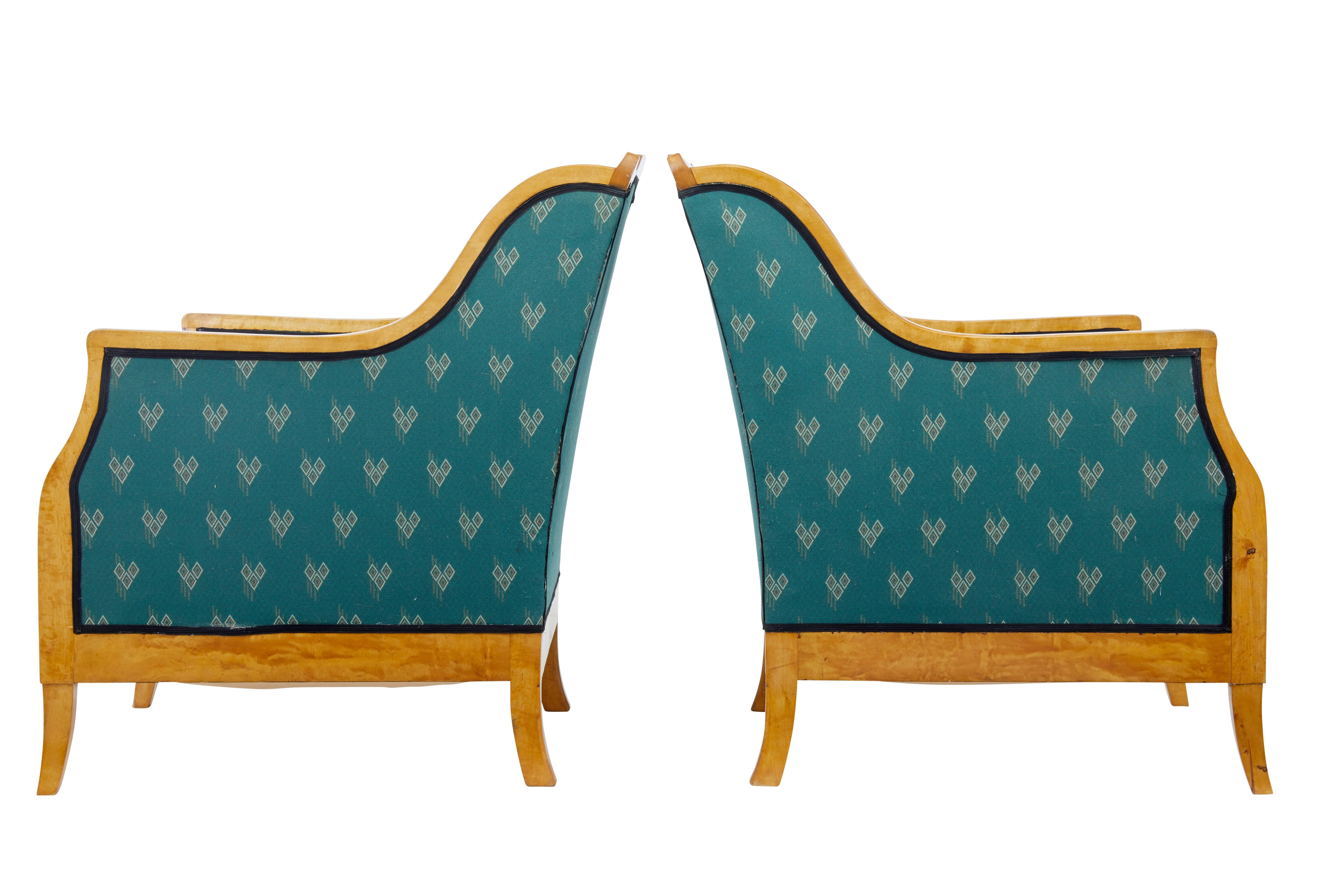 Elegant pair of Swedish birch, circa 1910.
Rich colored birch, shaped arm fronts and backs.
Well presented in contrasting green upholstery which is in good condition.
Minor loss to wood work on one back.

Measures: Height: 35 1/2