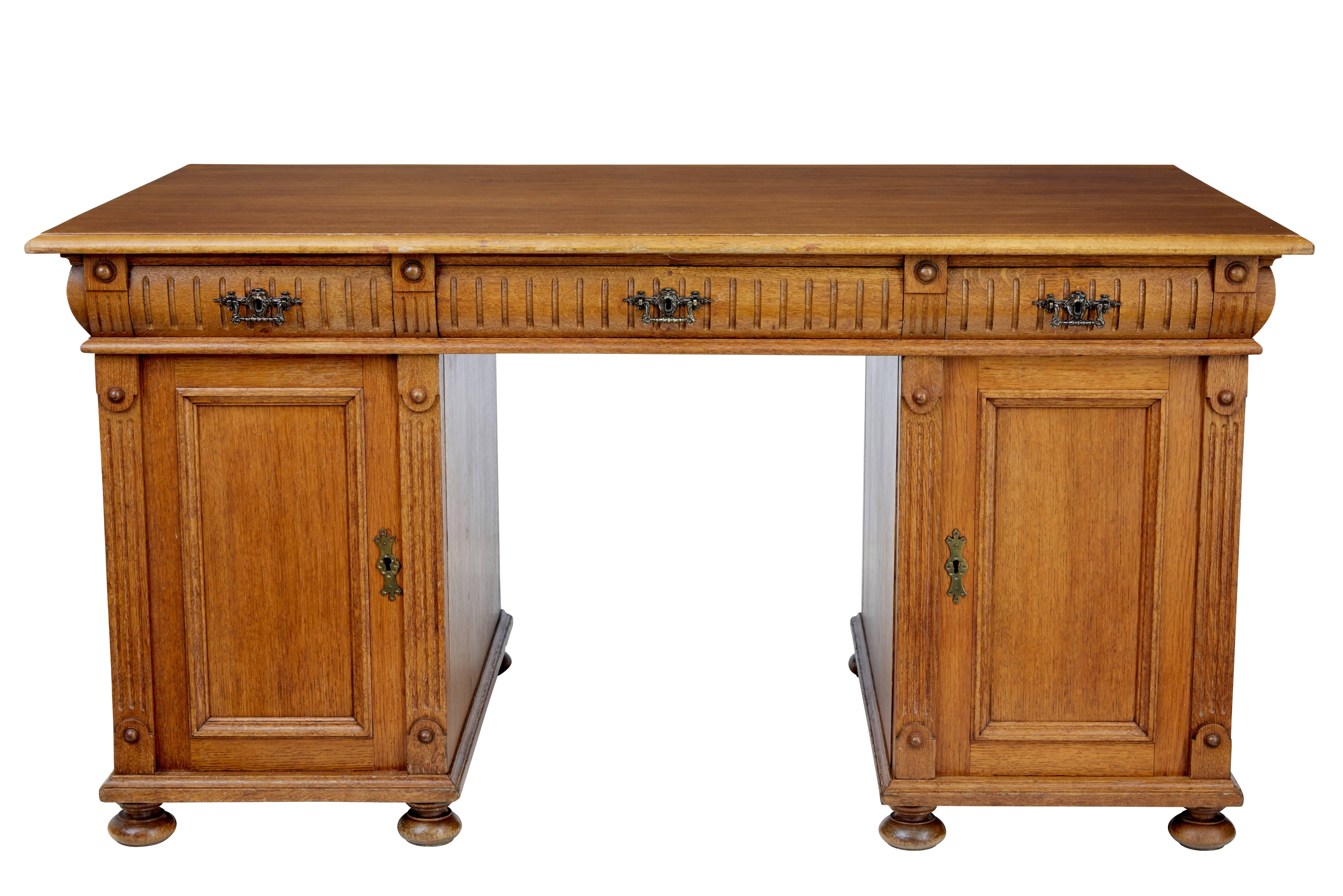 Rich golden oak pedestal desk, circa 1880.
Oak writing surface below which are three drawers.
Four pine drawer slides to the right hand side and two shelves to the left. On the reverse is a shallow cupboard containing a single shelf and space for