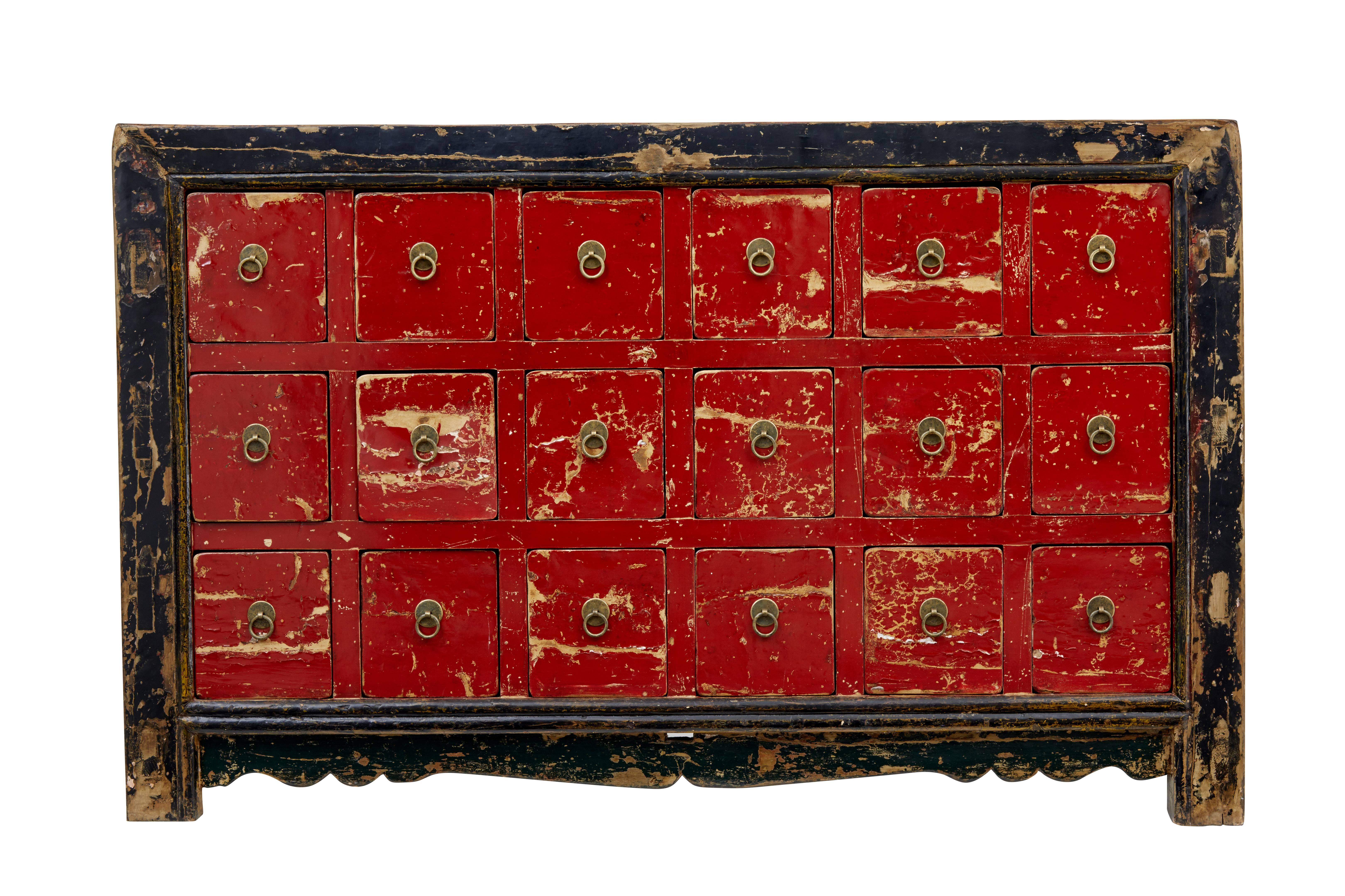 Decorative piece of Chinese export furniture, circa 1900.
Wide enough to serve as a sideboard, three banks of six drawers.
Red lacquer front, side and top with contrasting black frame.
Losses to lacquer and underneath paint.

Measure: Height 34