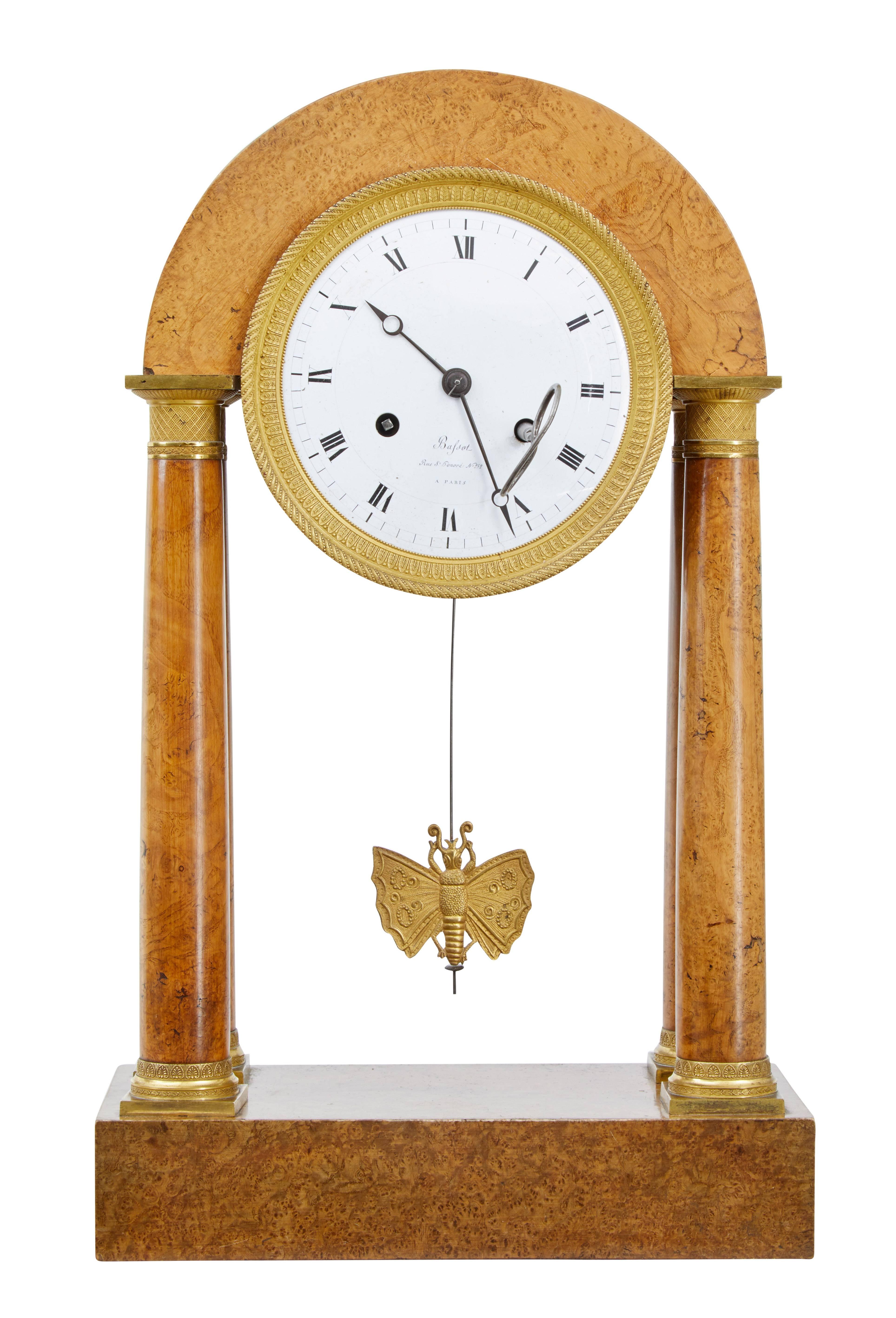 Beautiful piece of French empire design circa 1860.
Clock face with makers mark 'bafsot' rue st honore 252 a Paris.
Movement housed in a dome top, supported by burr columns and ormolu mounts, standing on an elm plinth base.
Butterfly pendulum.