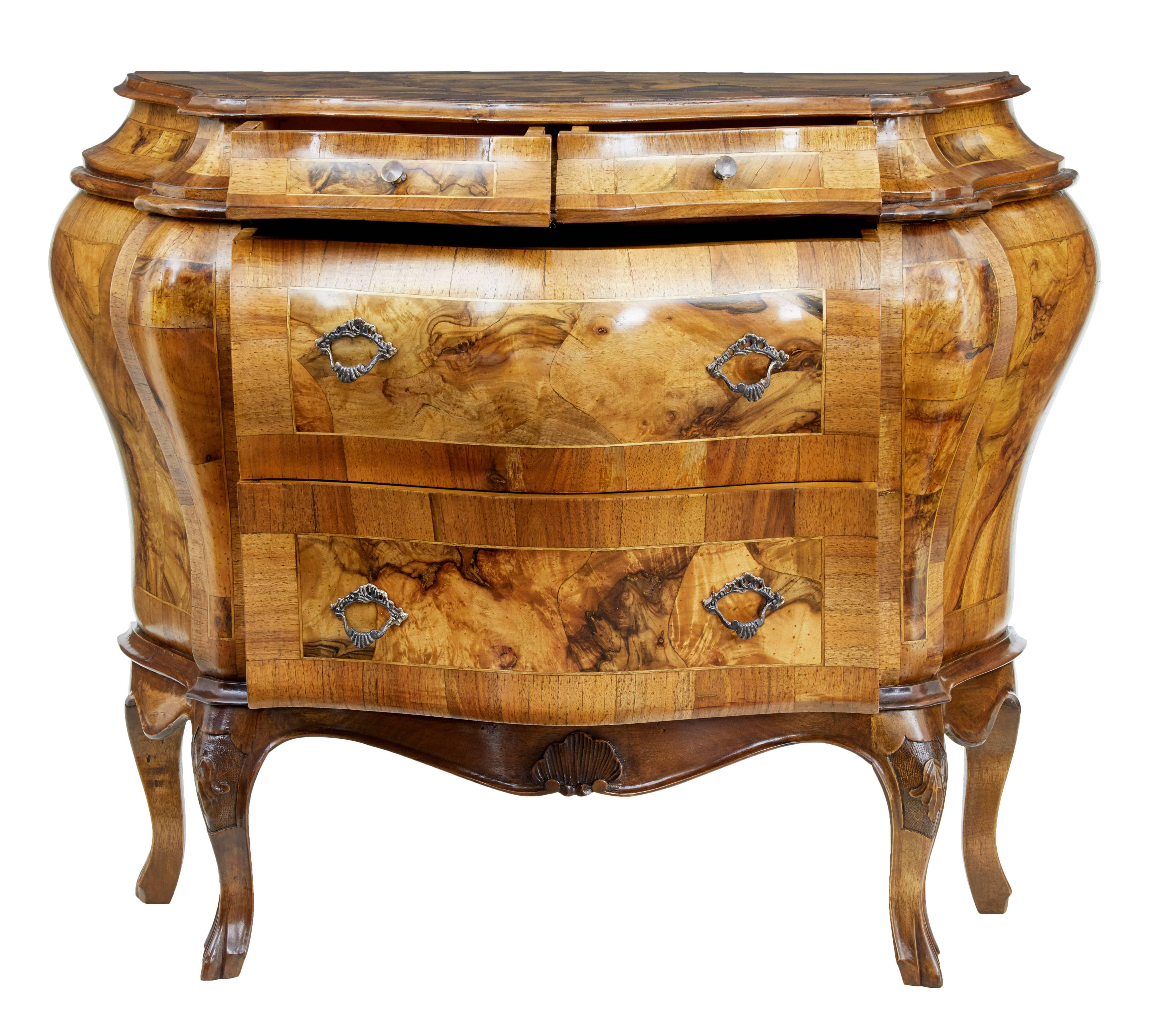 Elegant bombe shape commode from malta, circa 1900.

Made with stunning olivewood veneers over the traditional maltese carcass.

Two short drawers over two long. Brass button handles to the top drawers and ornate handles to the lower