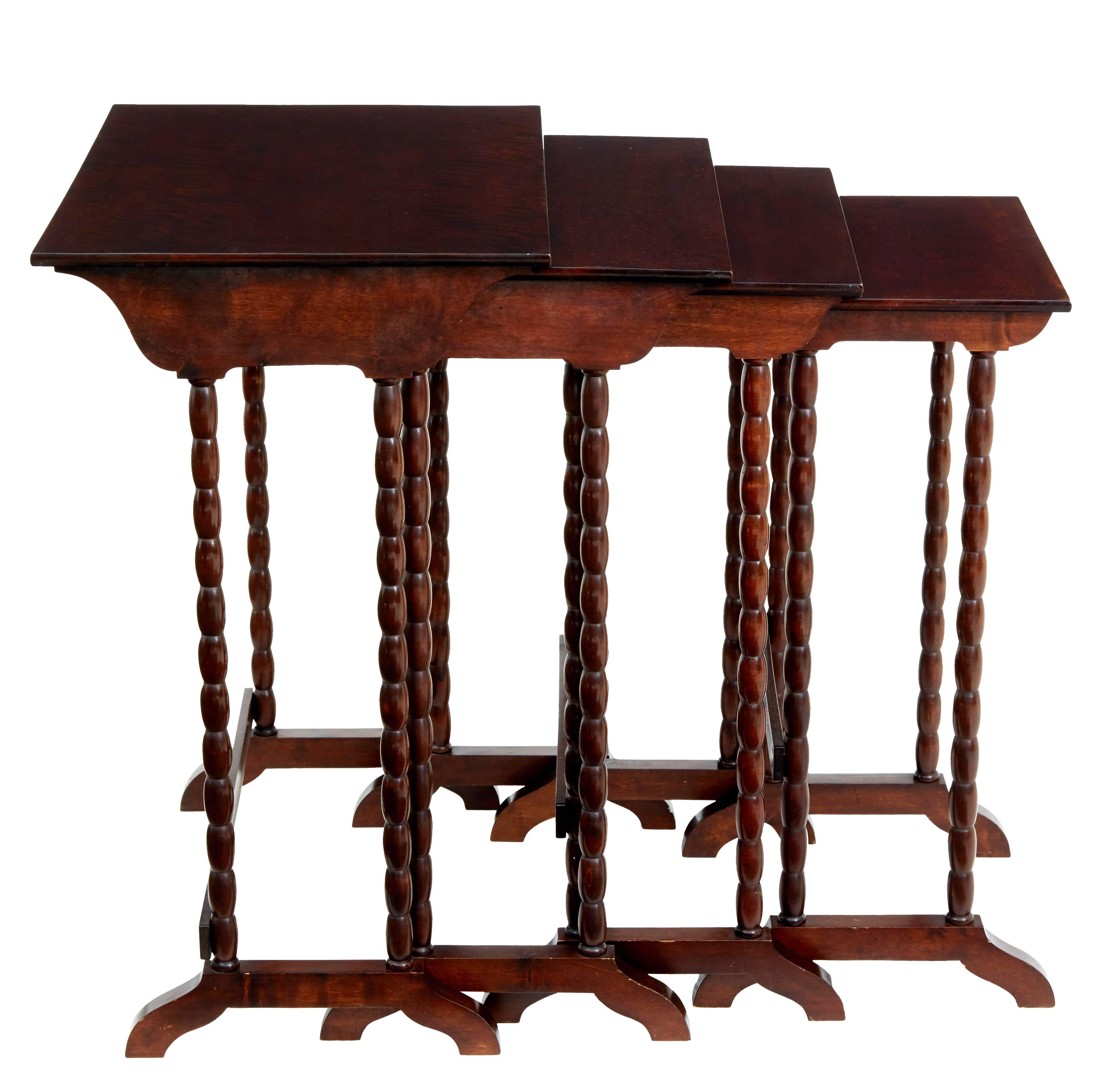 Scandinavian birch nest of four occasional tables, circa 1950.

Good quality birch which has been stained to the color of mahogany.

Bobbin turned legs.