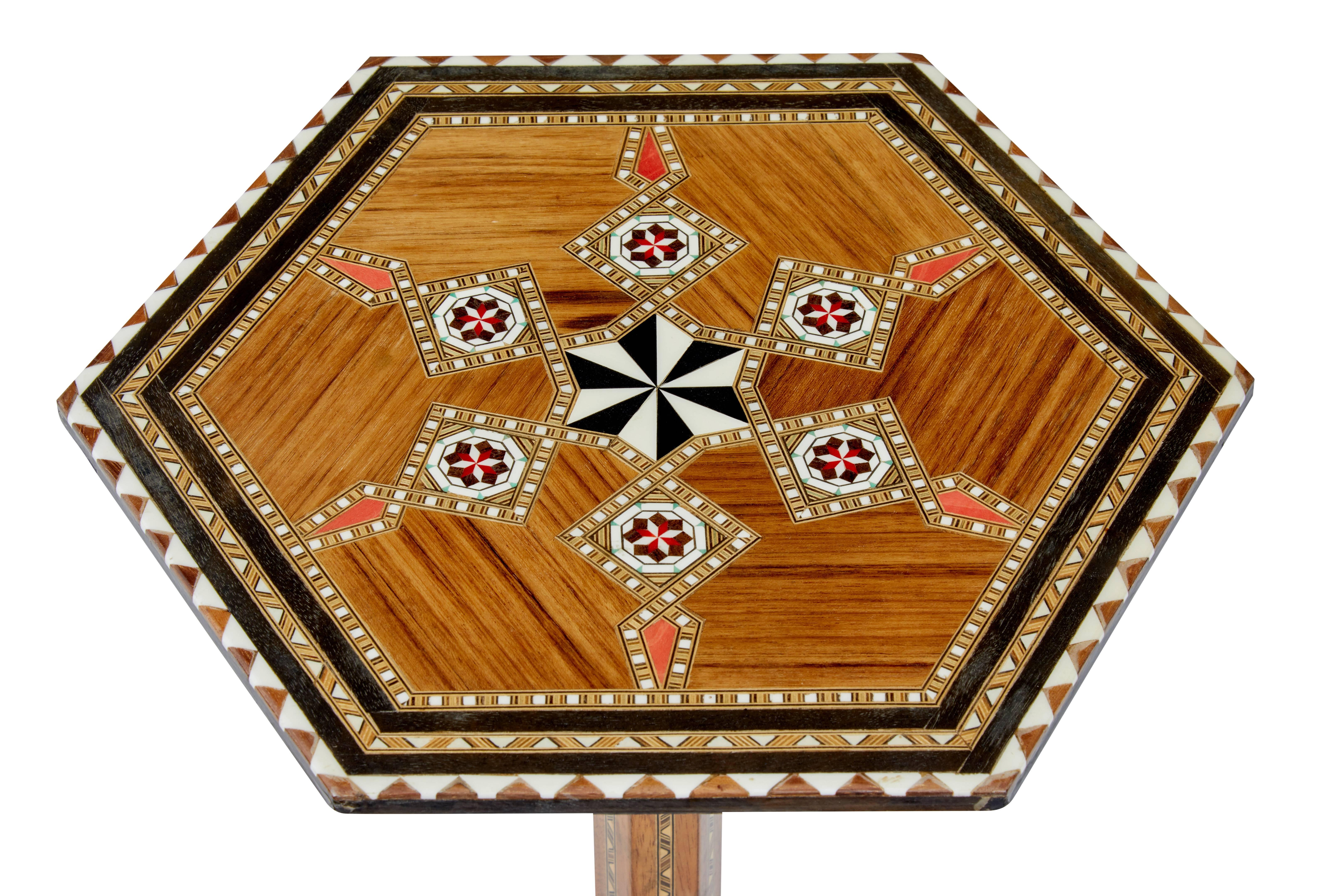 Small occasional table in the damascan taste.

Hexagonal top with inlay, supported by a hexagonal stem and further hexagonal base to complement.