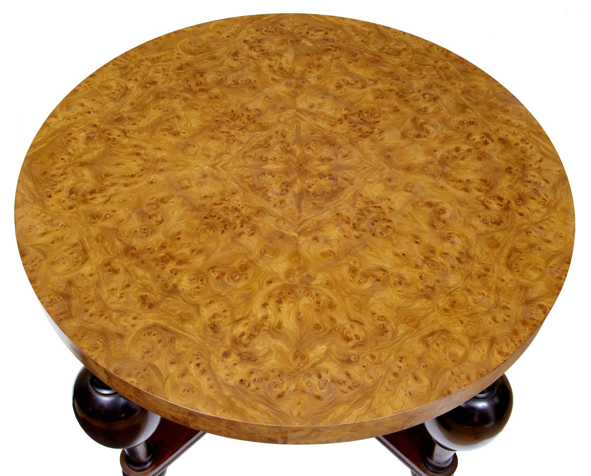 Stunning burr elm veneer top Swedish coffee table, circa 1930s. Standing on bulbous turned legs united by a x frame stretcher.

Measures: Height: 24 1/2