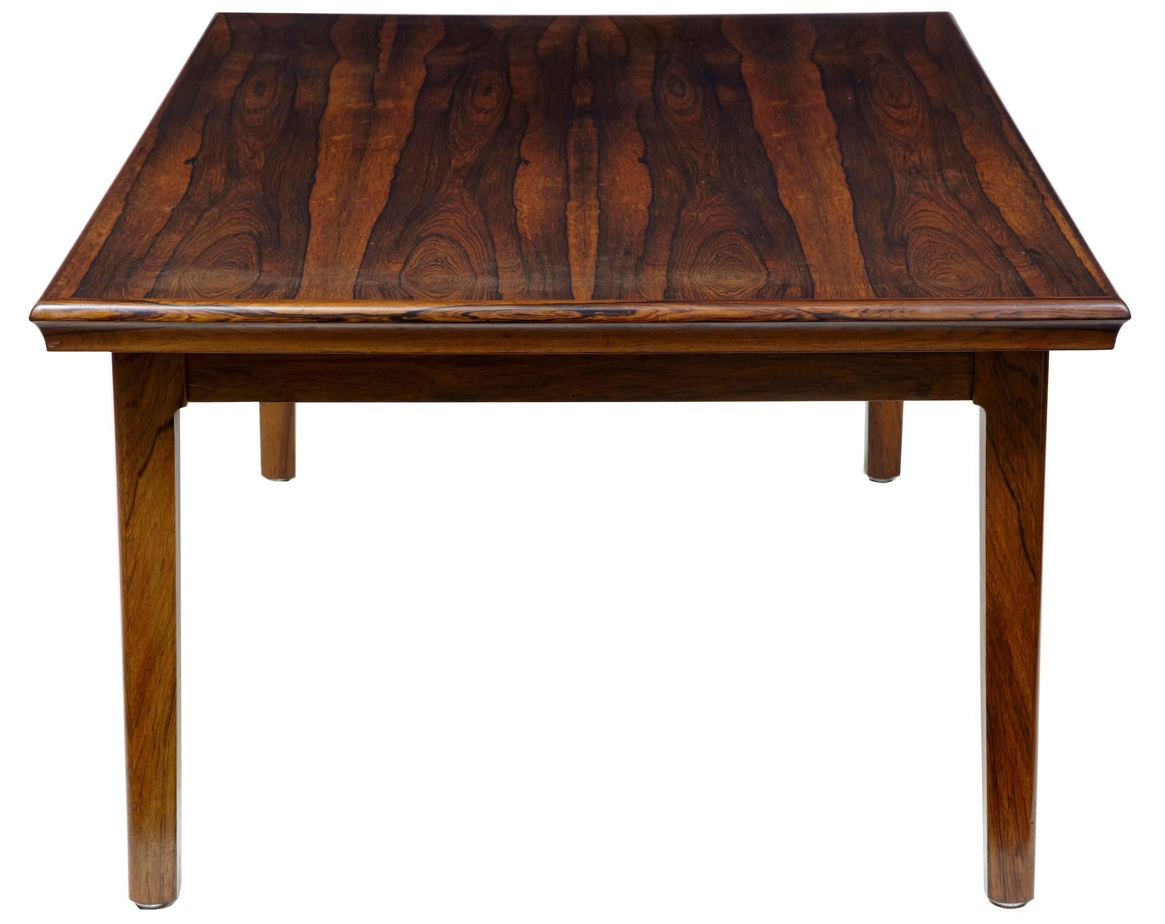 Rosewood coffee table, circa 1960. For some reason unknown to us, this table is fitted with a mechanism that lifts up the height by a few inches. Slight bloom on the surface, but otherwise in excellent order

Measures: Height: 20 1/2