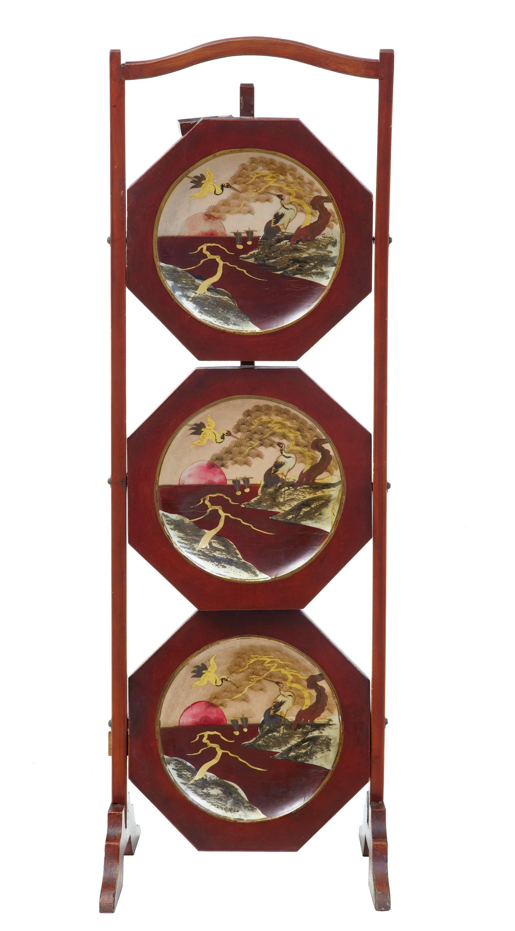 Three-tier cake stand which closes when not in use. Painted scene with herons. Some wear to red lacquer.

Height: 31