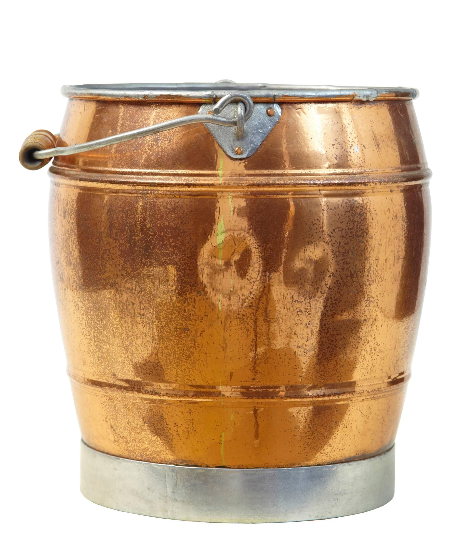 Fine keg shaped bucket, circa 1890. Steel rimmed base with wooden handle.

Measures: Height: 12