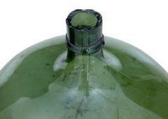 Two Large Green Glass Distillery Bottles