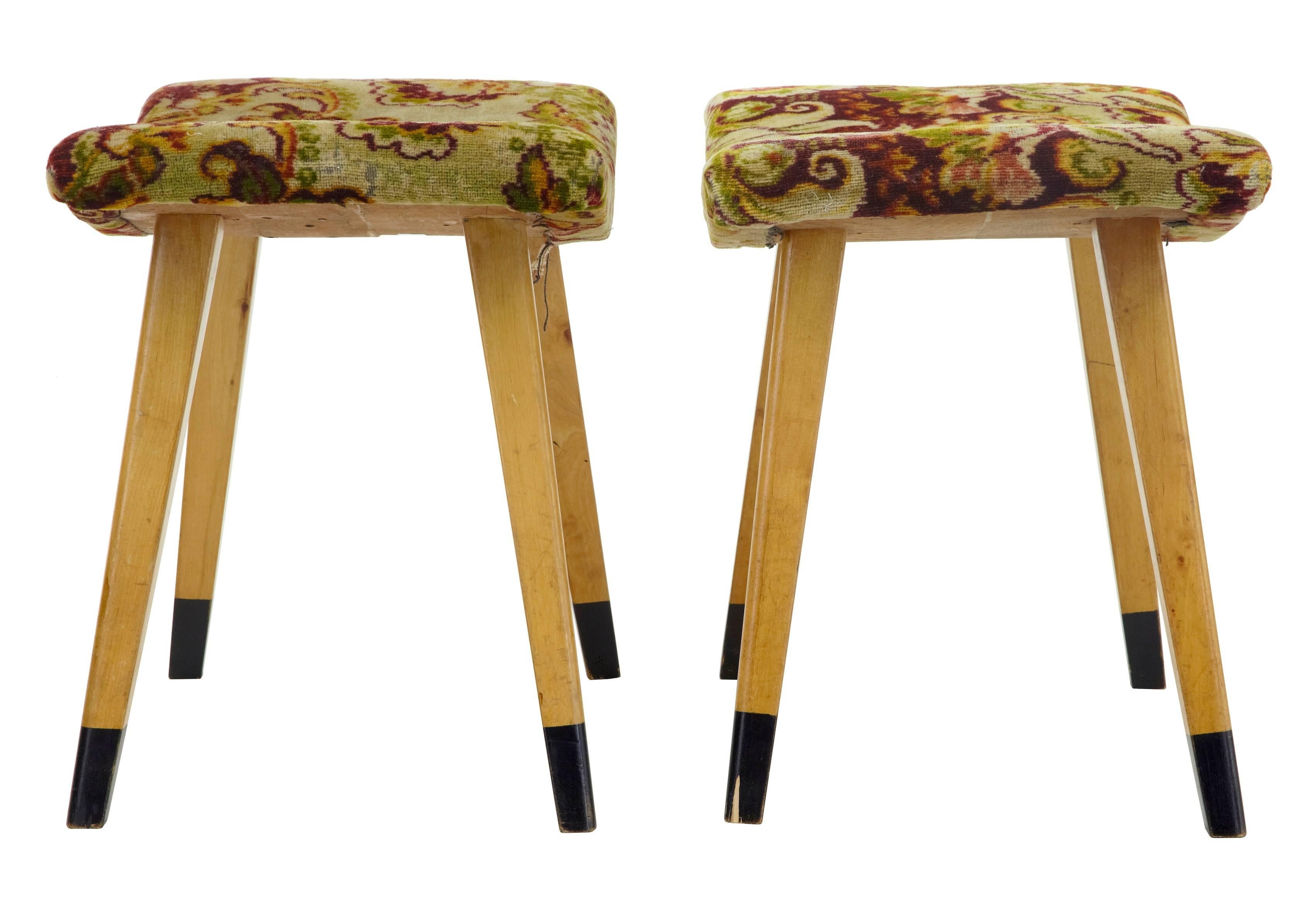 Pair of birch stools with original striking fabric, circa 1960. Shaped seats, with 4 tapering birch legs and ebonized tips.

Measures: Height 17 1/4