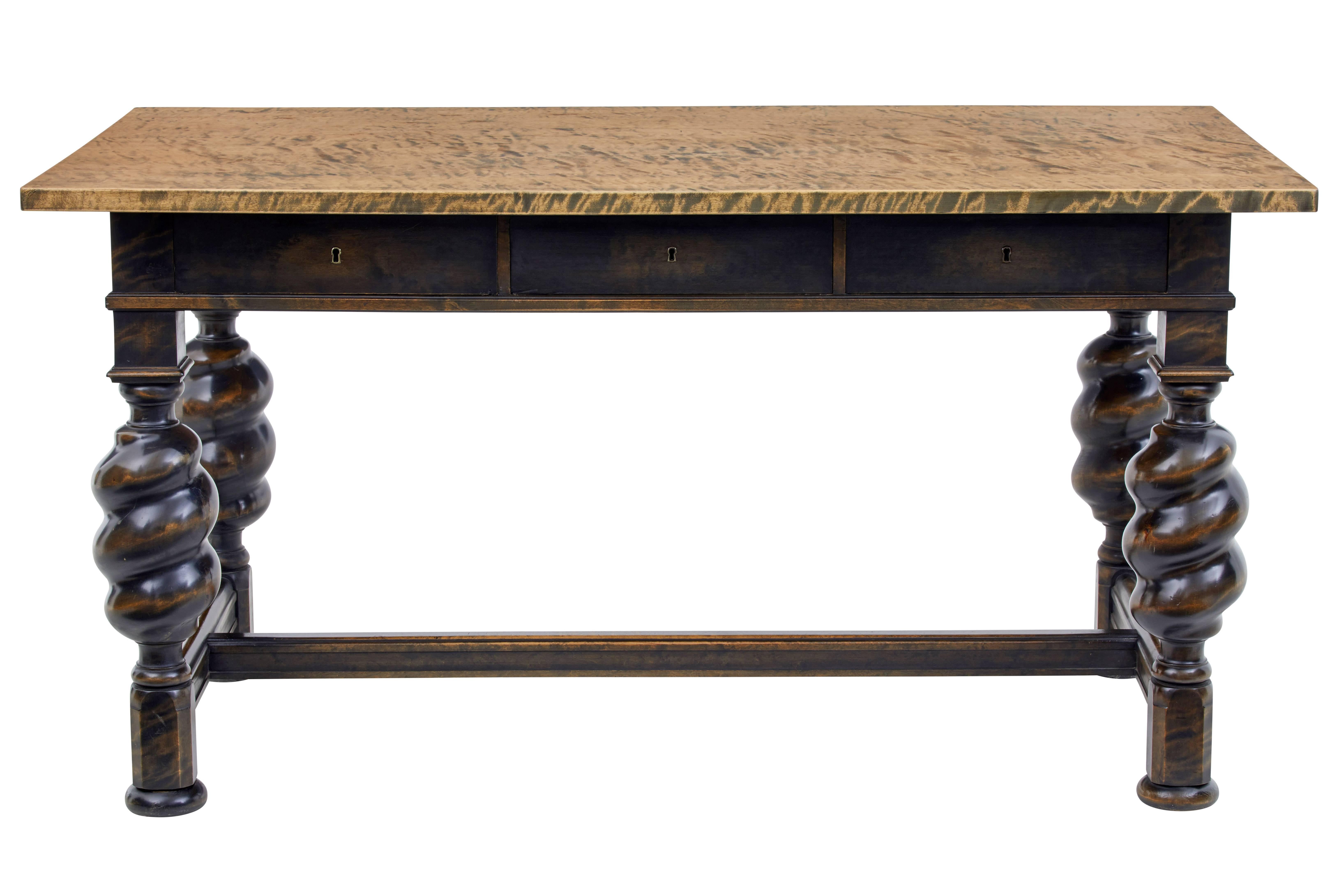 Unusual and good quality birch writing table desk, circa 1930.

Two tone dark base with contrasting golden birch top. Three full depth drawers to the front.

Standing on four turned baluster legs, united by H-frame stretcher. Standing on flat
