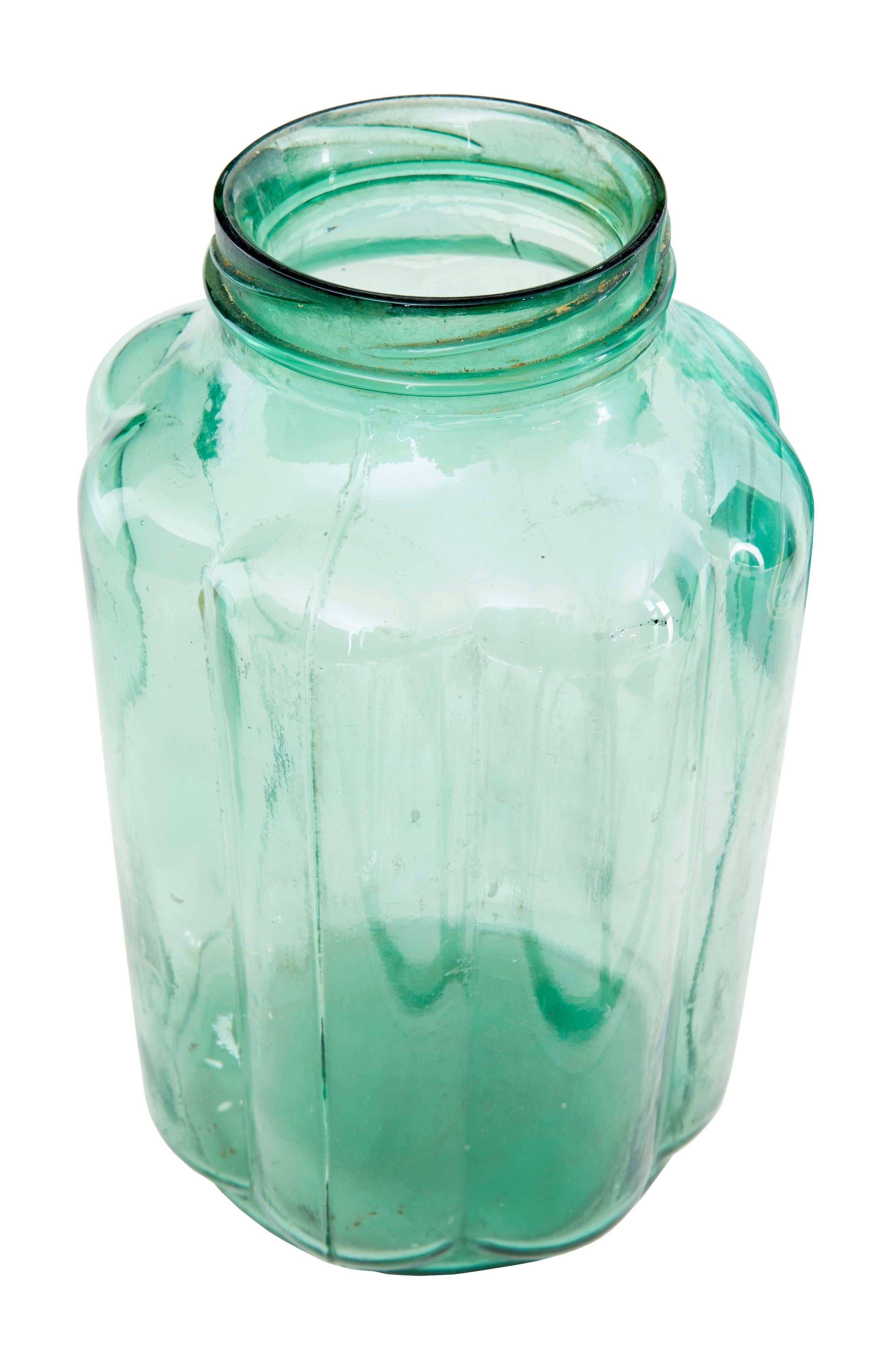 Unusual collection of cucumber preserving jars, circa 1900. Now ideal for beautiful decorative vases. Originally would have had screw on lids which are no longer present. Deep green color with organic cucumber shaping.

Measure: Height