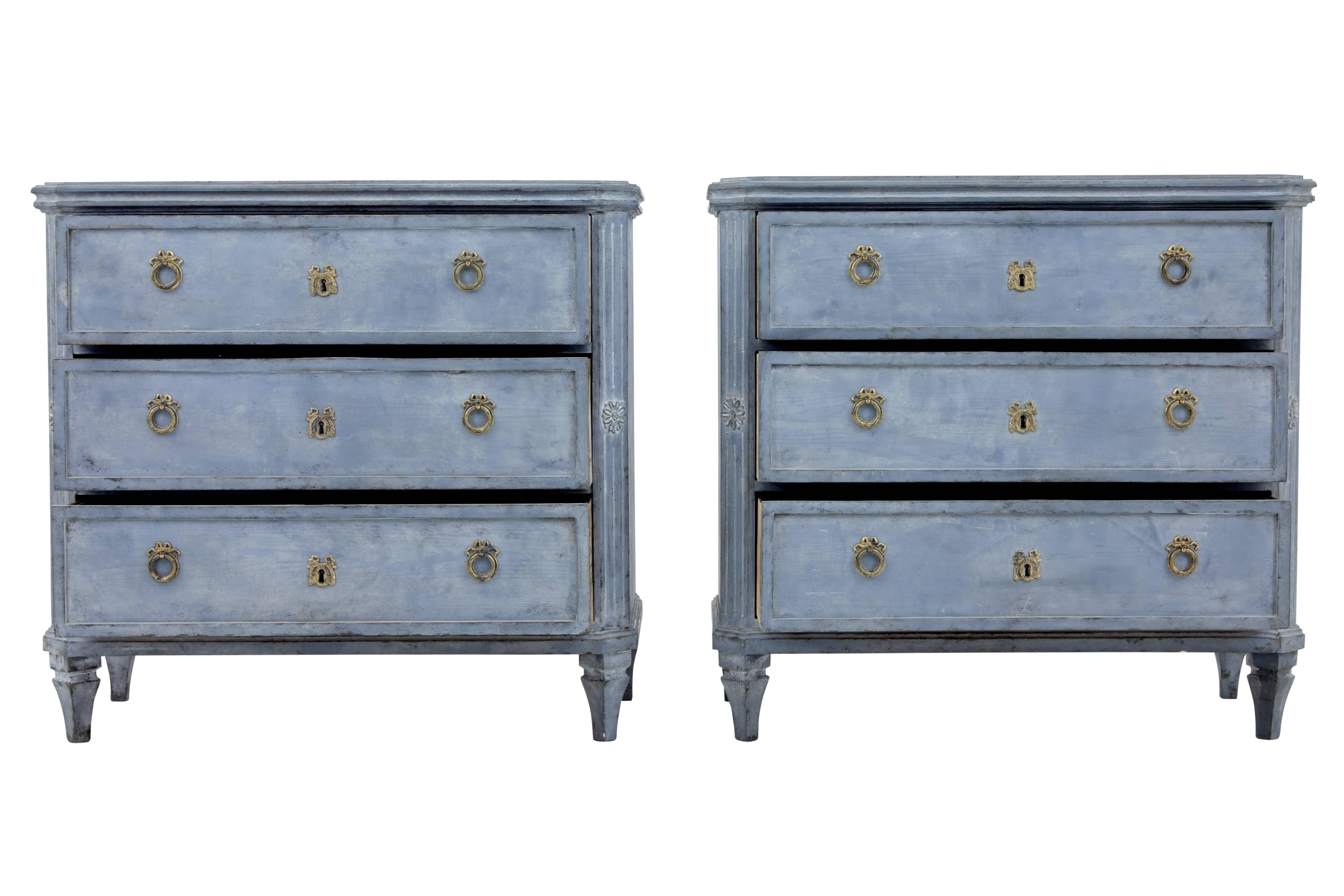 Pair of Swedish painted commodes, circa 1860.

Three drawers with brass ring handles and escutheons. Later paint has now taken on a weathered appearance.

Fluted canted corners with applied rosettes.

Faded paint and minor losses.