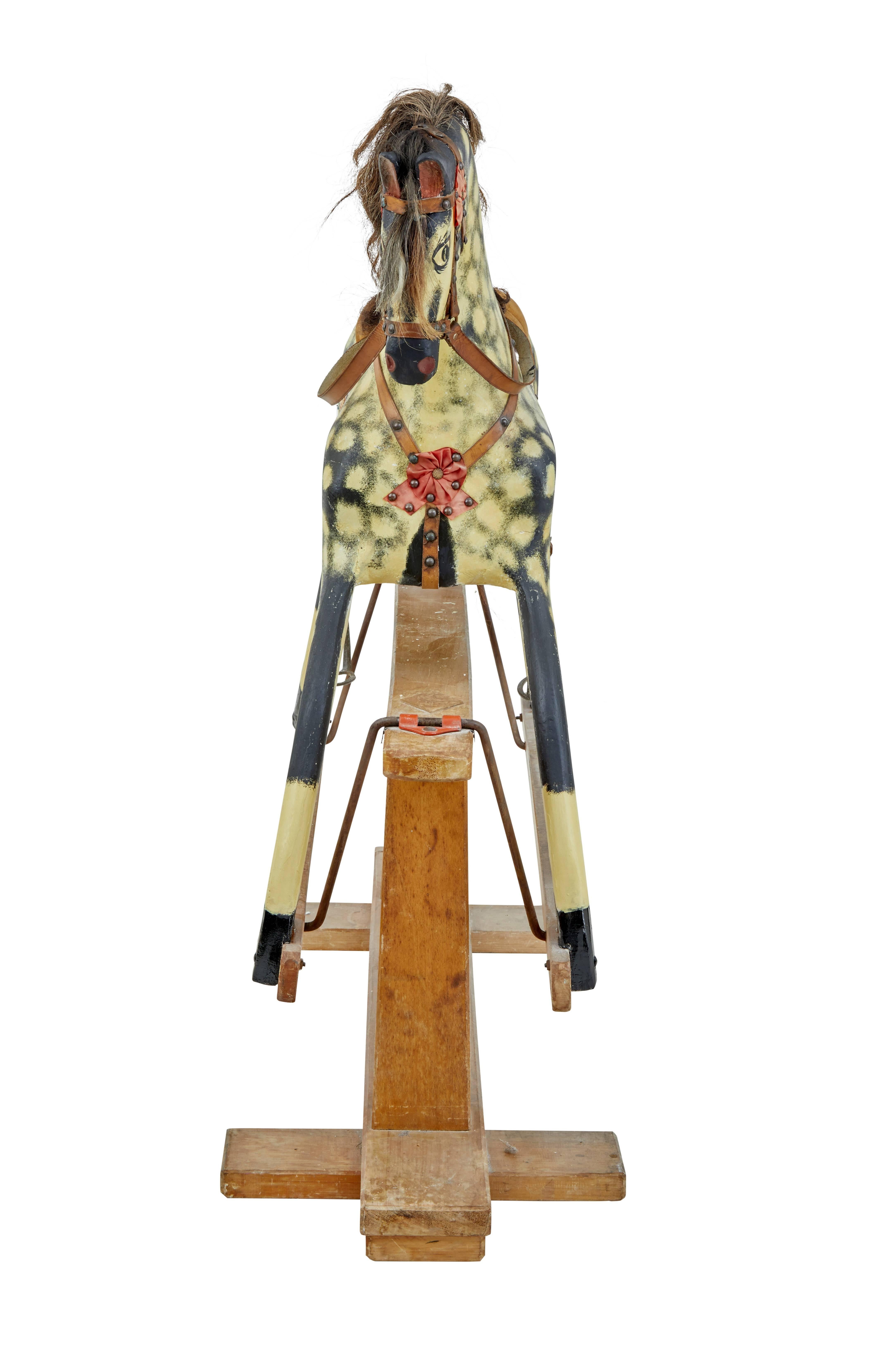 Here we present a beautiful wooden rocking horse by Collinson of Liverpool, circa 1890.

Painted dapple grey horse with real horse hair mane and tail.

Fitted on oak safety stand.

The large proportions of this model makes it ideal for both