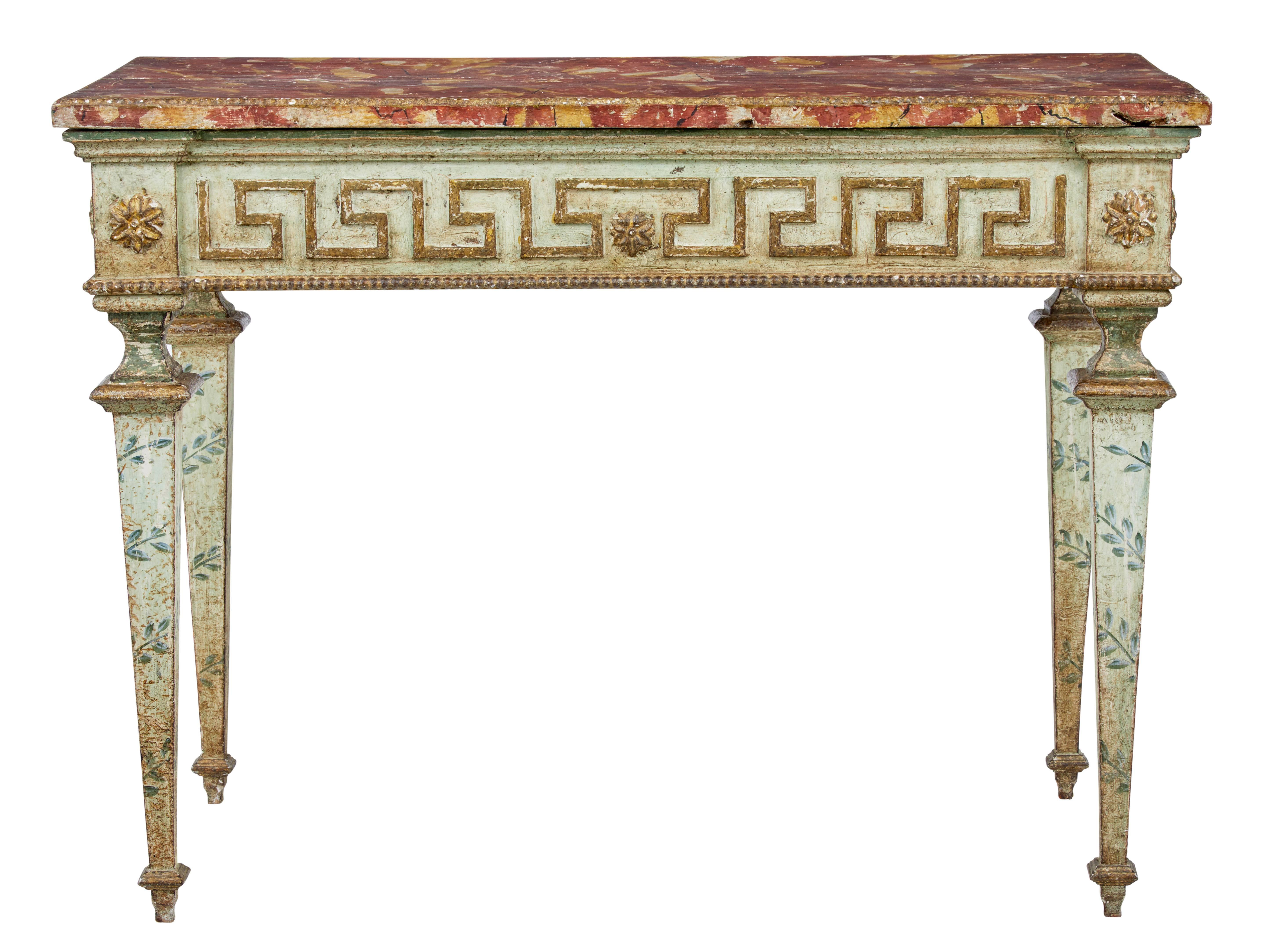 We are pleased to offer this stunning pair of Tuscan Italian console tables, circa 1880.

Faux marble painted top to simulate sienna marble with gilt beaded edge.

Gilt Greek key design to the frieze with applied rosettes. Each table standing on