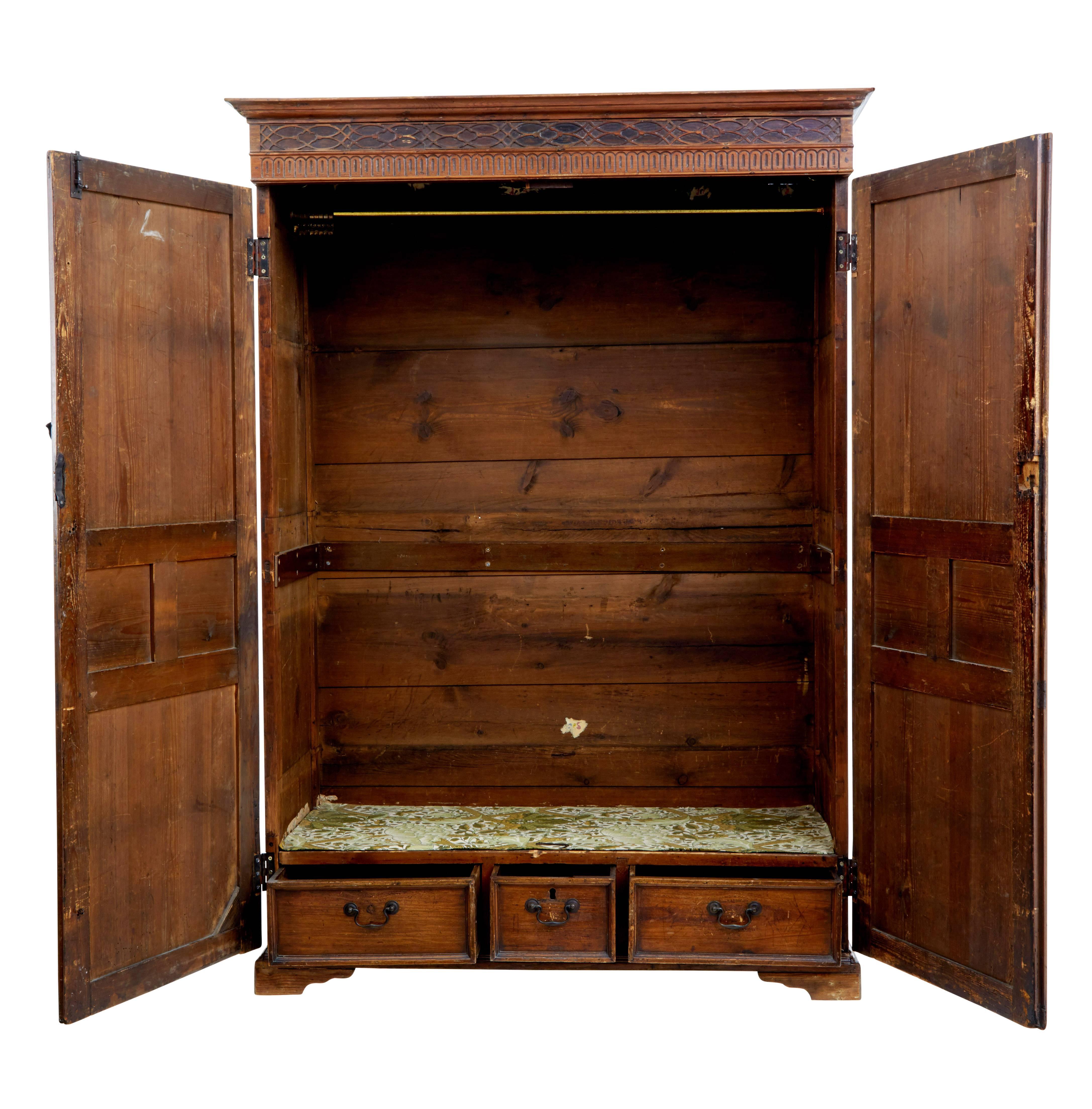 Unusual English pine cupboard, circa 1830.

Rare to find a piece of English furniture this size in pine. Since being converted into a gentleman’s wardrobe.

Interior comprising of a brass rail for clothes and three fitted drawers in the