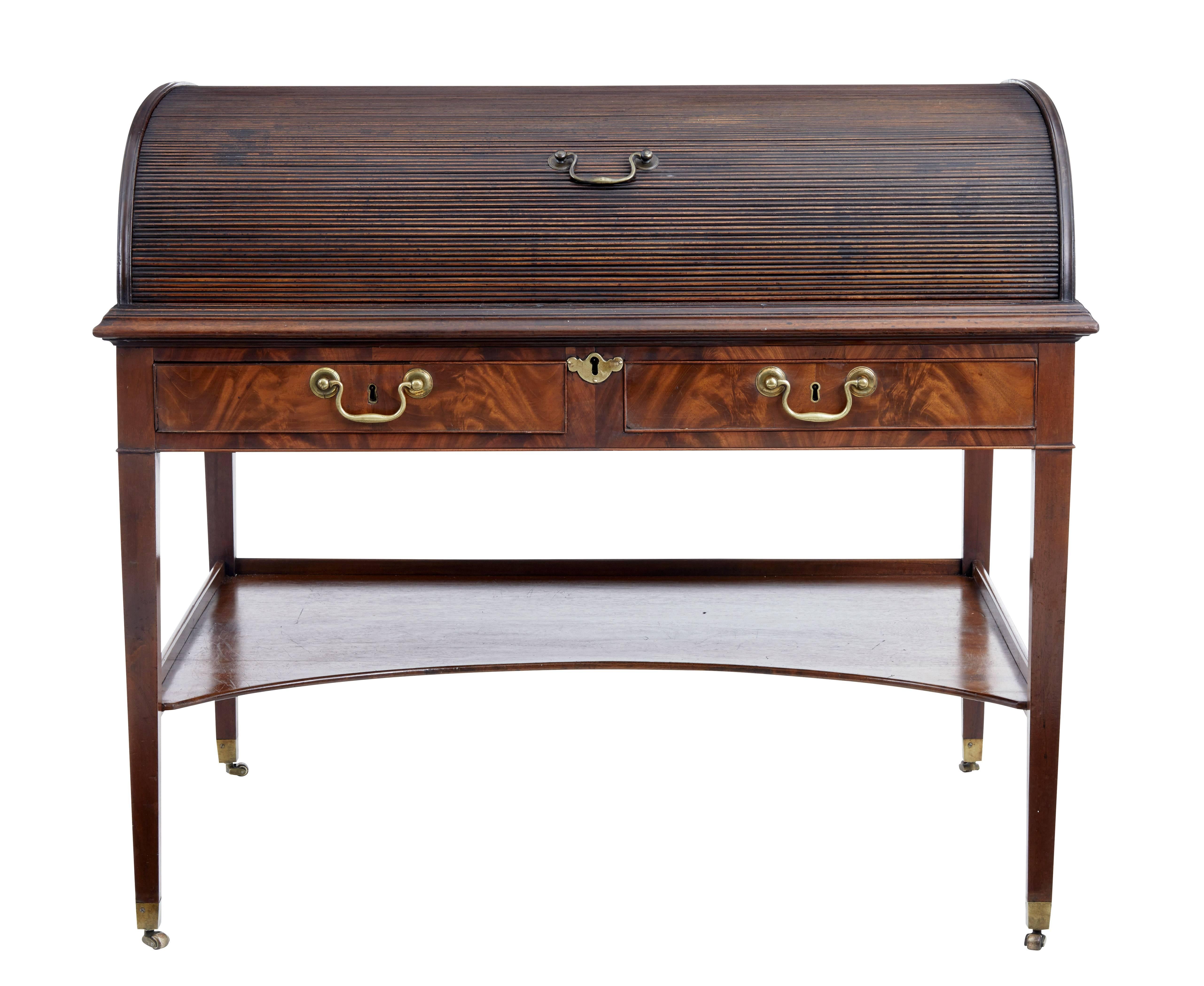 Ne quality English mahogany roll top desk, circa 1830.

Rare piece of English furniture we found on our travels to Sweden. Tambour roll top is in good working order. Top rolls back to reveal a fitted interior. Eight drawers, four of which are