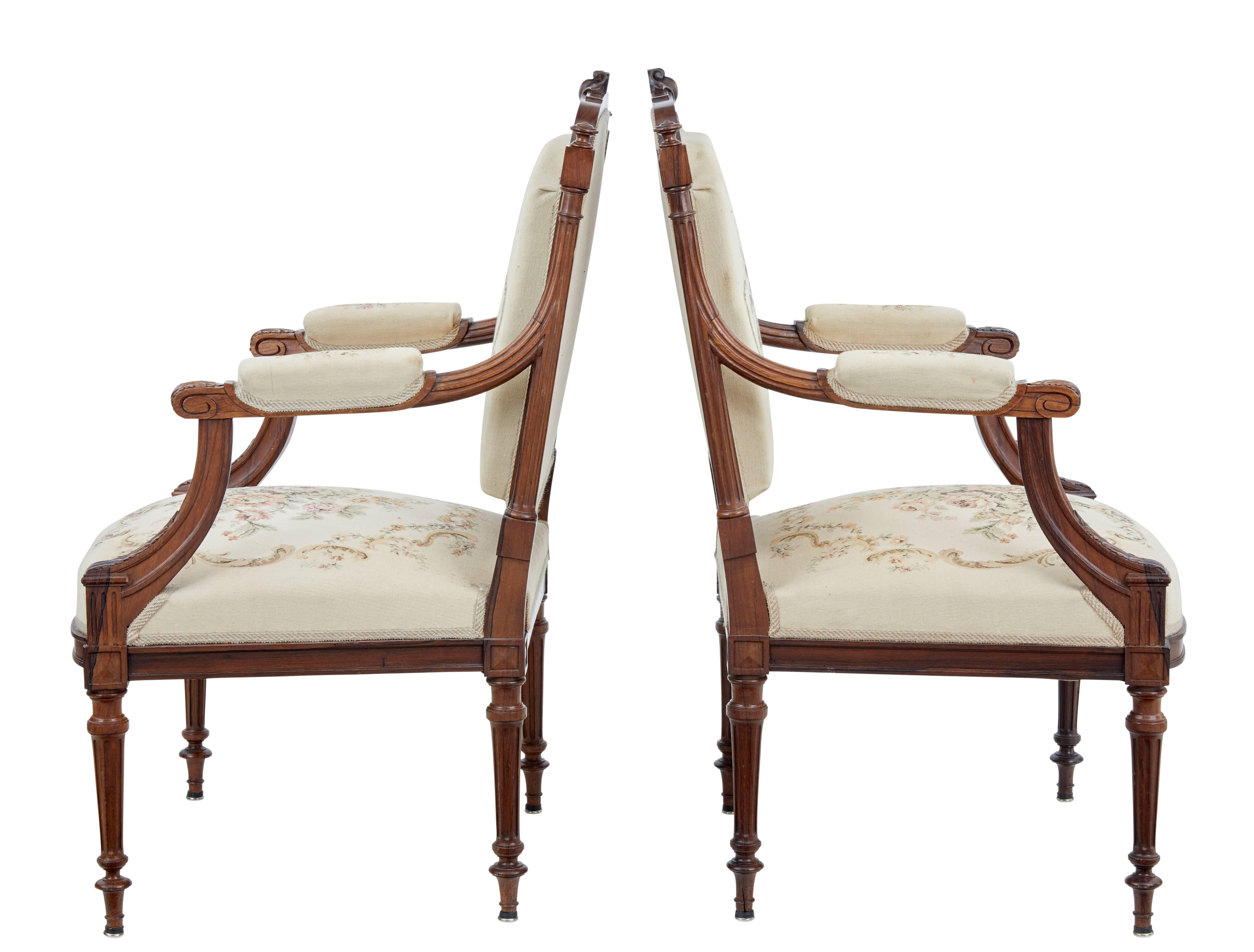 Good quality pair of French rosewood and walnut armchairs, circa 1890.

Heavy sturdy chairs due to the nature of the timber used, but with typical French elegance.

Carved cartouche to the back rest with fluted supports which continue down the