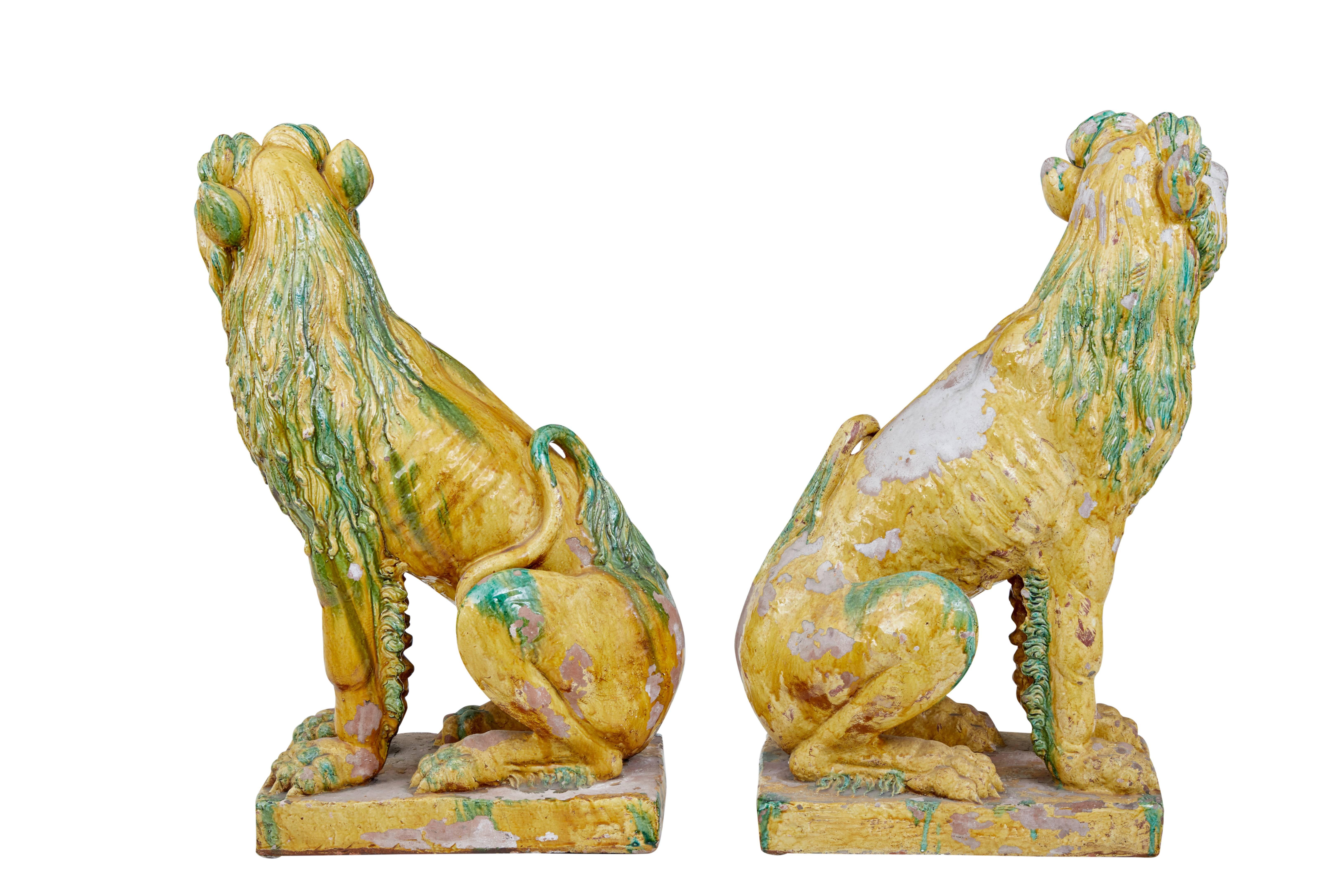 Chinese Export Pair of 20th Century Tall Indonesian Salt Glazed Decoration Dogs