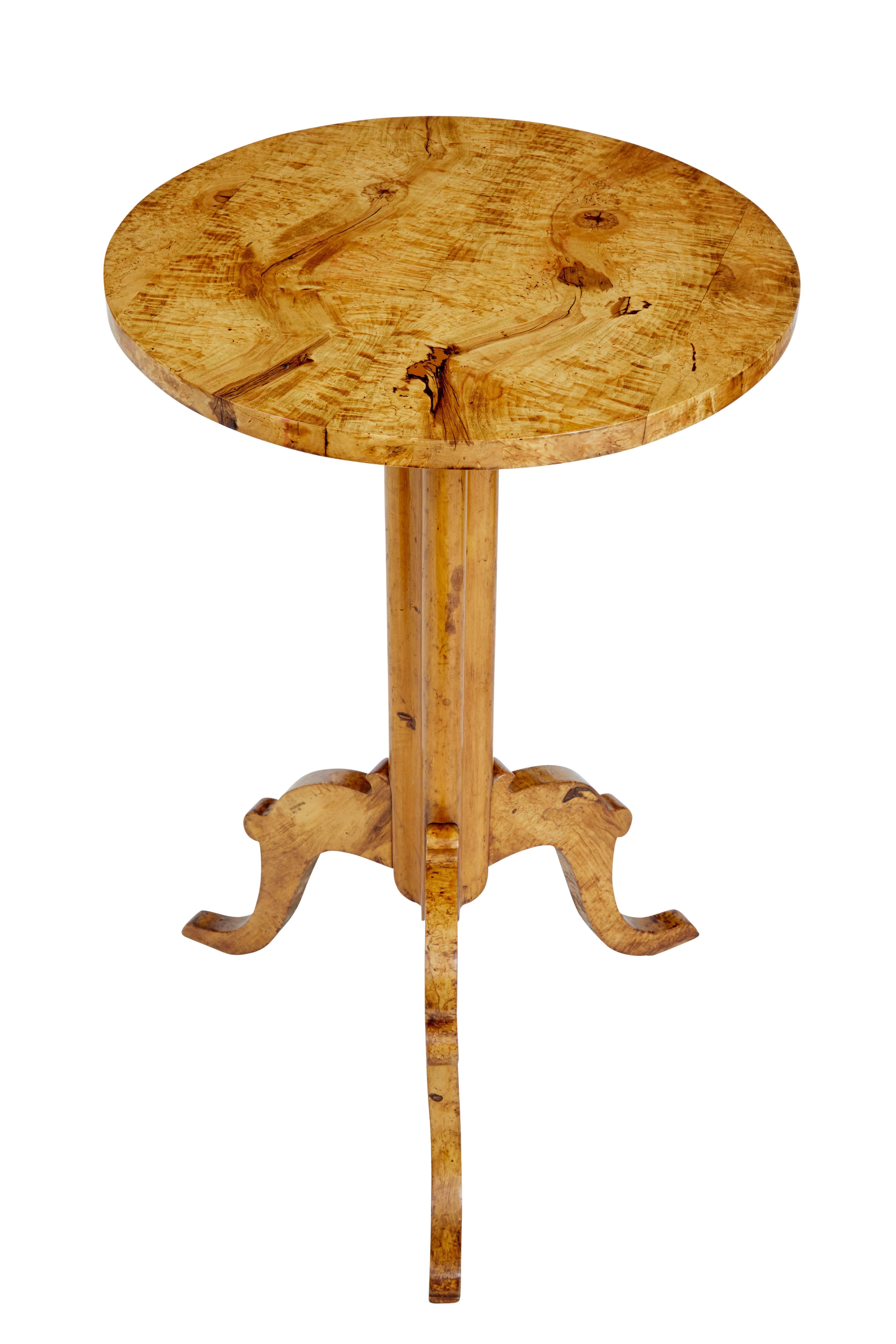 Good quality Swedish birch root table, circa 1860.

Solid burr birch circular top, standing on shaped stem and scrolled legs.

Rich golden color.

Area of restoration to the top were a wood knot was, but this has been done sympathetically.