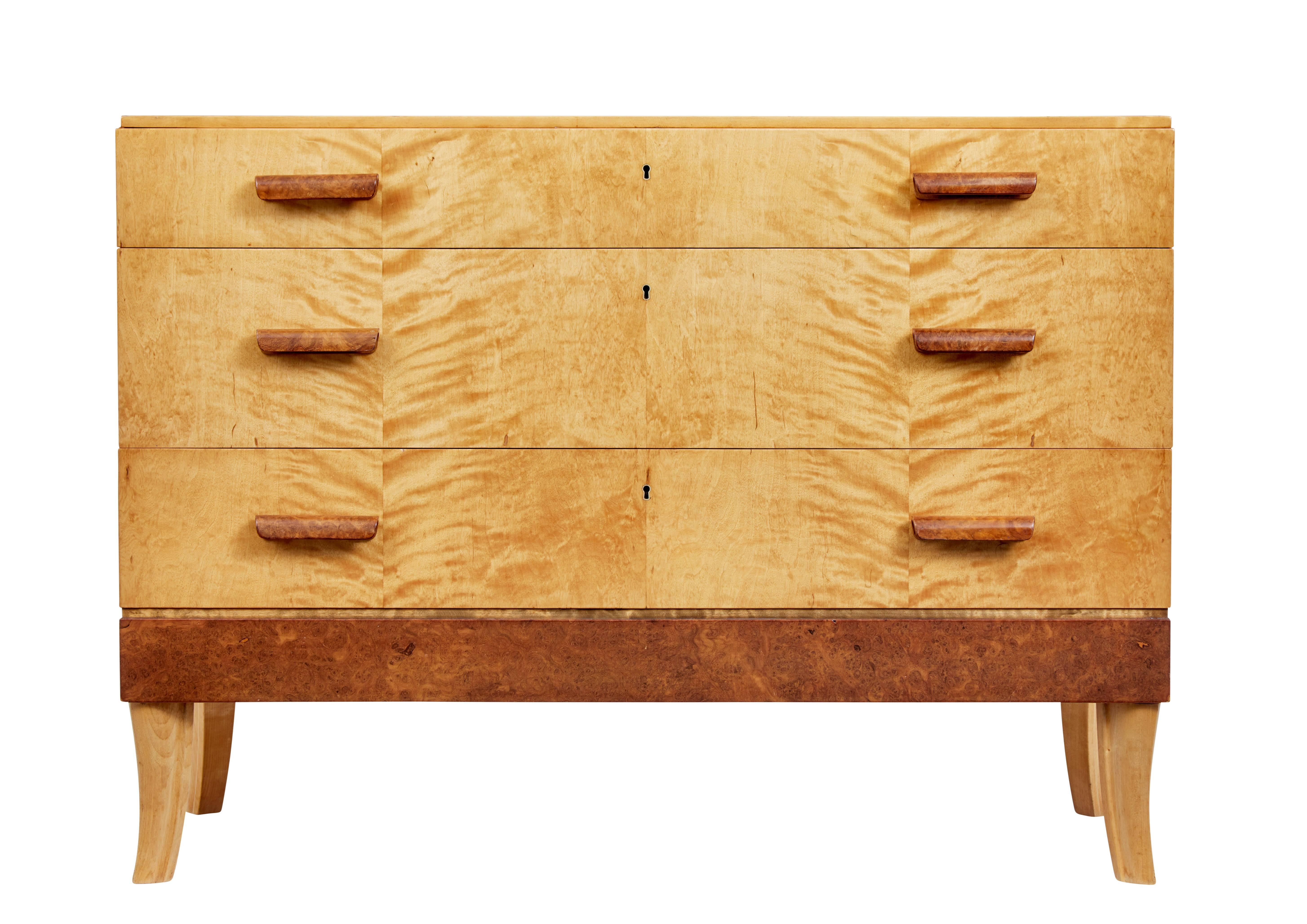 Delightful chest of drawers rich in the Art Deco taste, circa 1950.

Three drawers fitted with burr shaped handles, top drawer fitted with partitions and fitted turned bowl for jewellery etc.

Handles and bottom burr panel add contrast to the