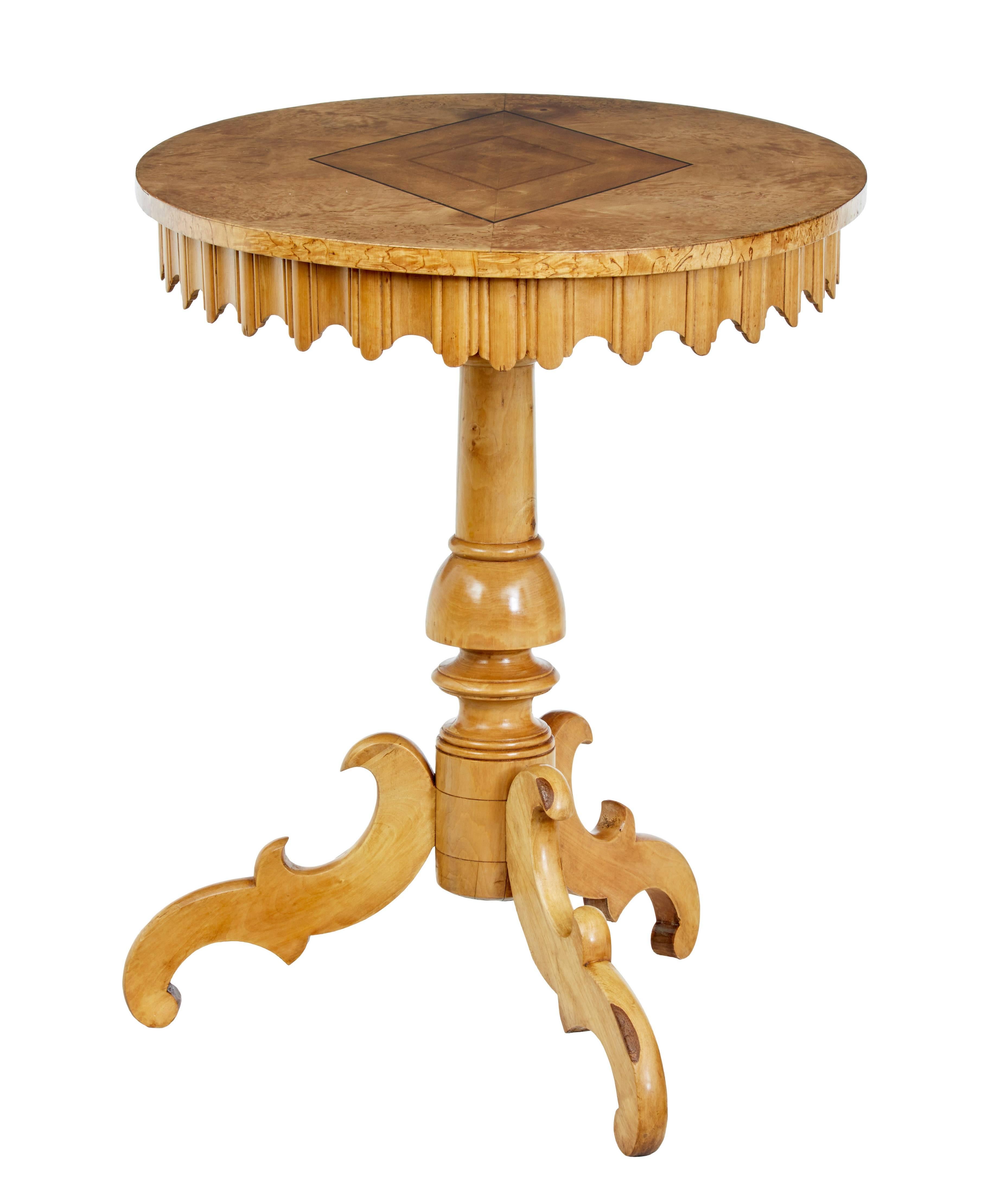 Charming 19th century oval table, circa 1850.

Burr birch top with walnut inlaid diamond shape strung with ebony.

Carved Gothic shaped frieze, standing on turned stem tripod base.

Minor mark to top, restored age split to stem base.