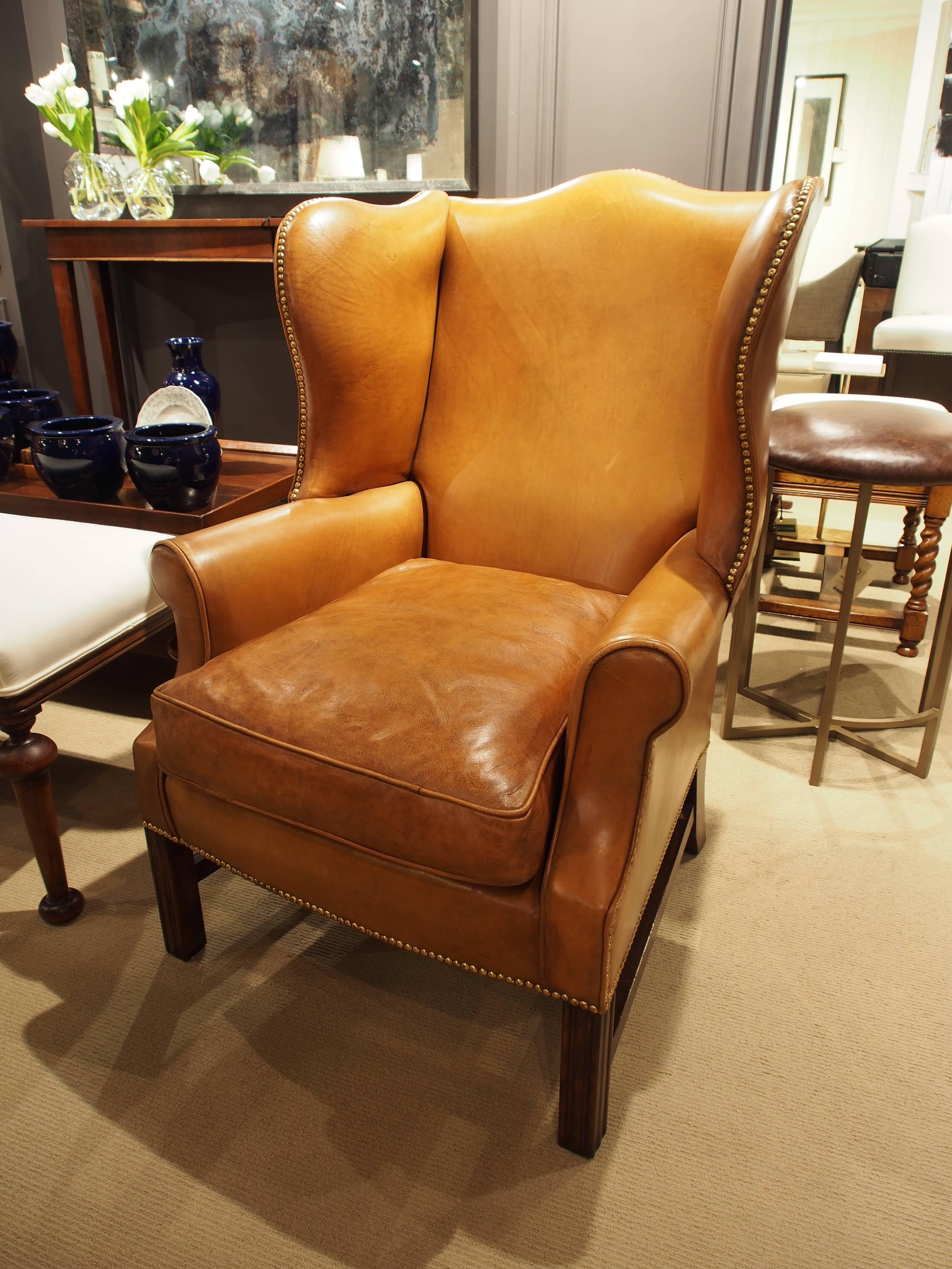 English Wing Chair in Light Tan Leather with Brass Nailheads For Sale