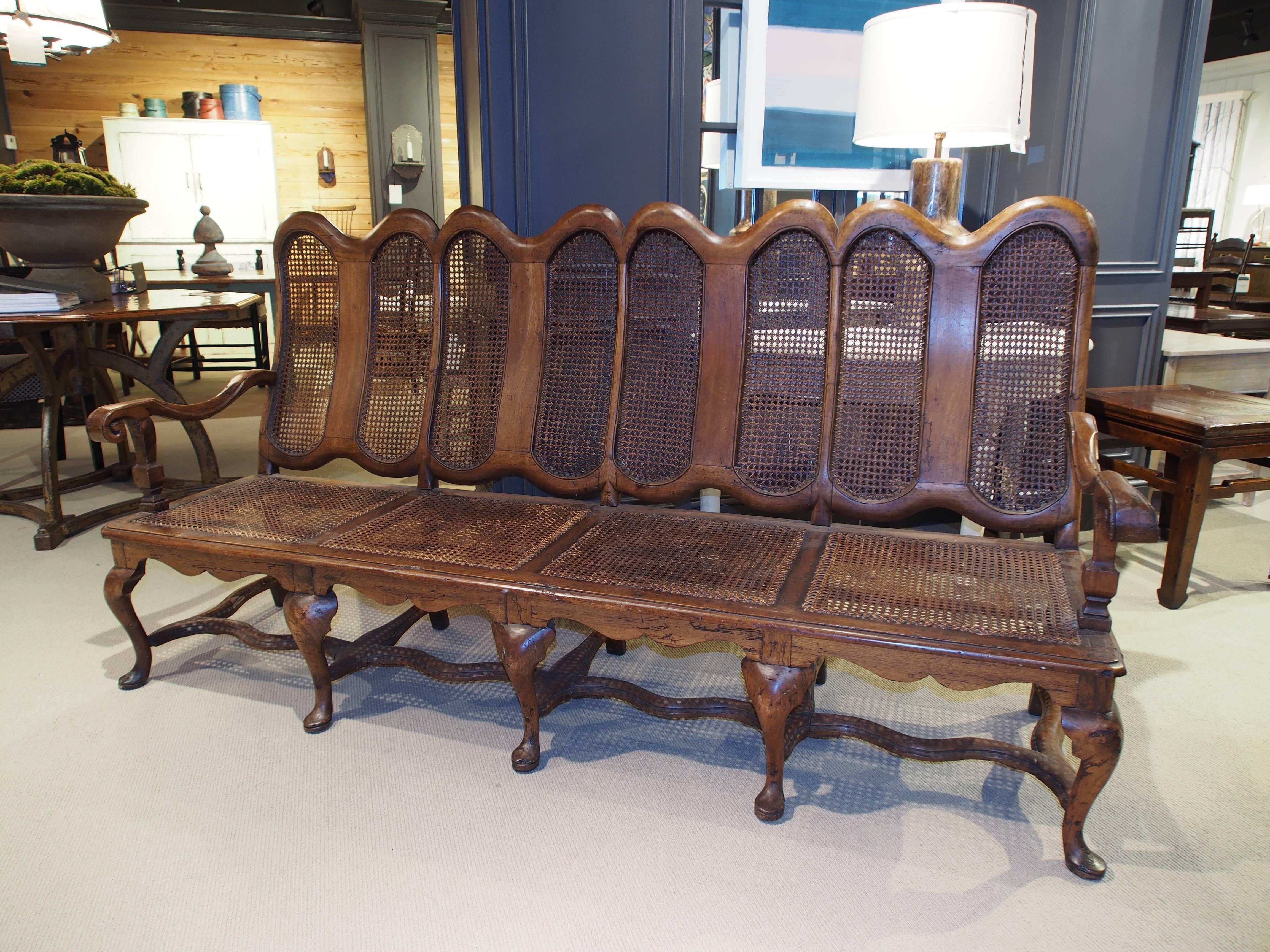French settee in walnut and cane.