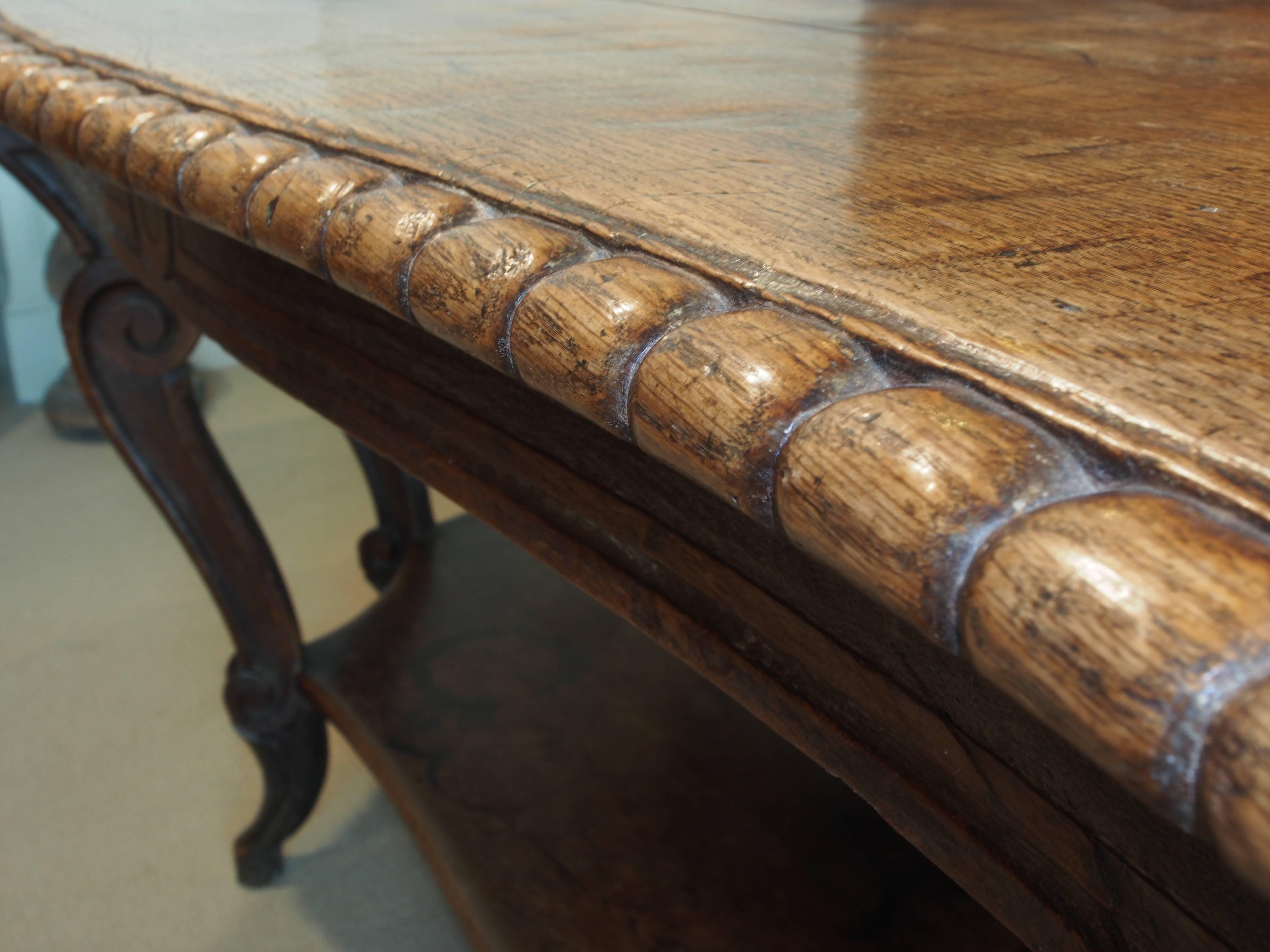 Italian Walnut Carved Table, 19th Century, with 8 Curved Legs and Low Shelf In Good Condition For Sale In Atlanta, GA