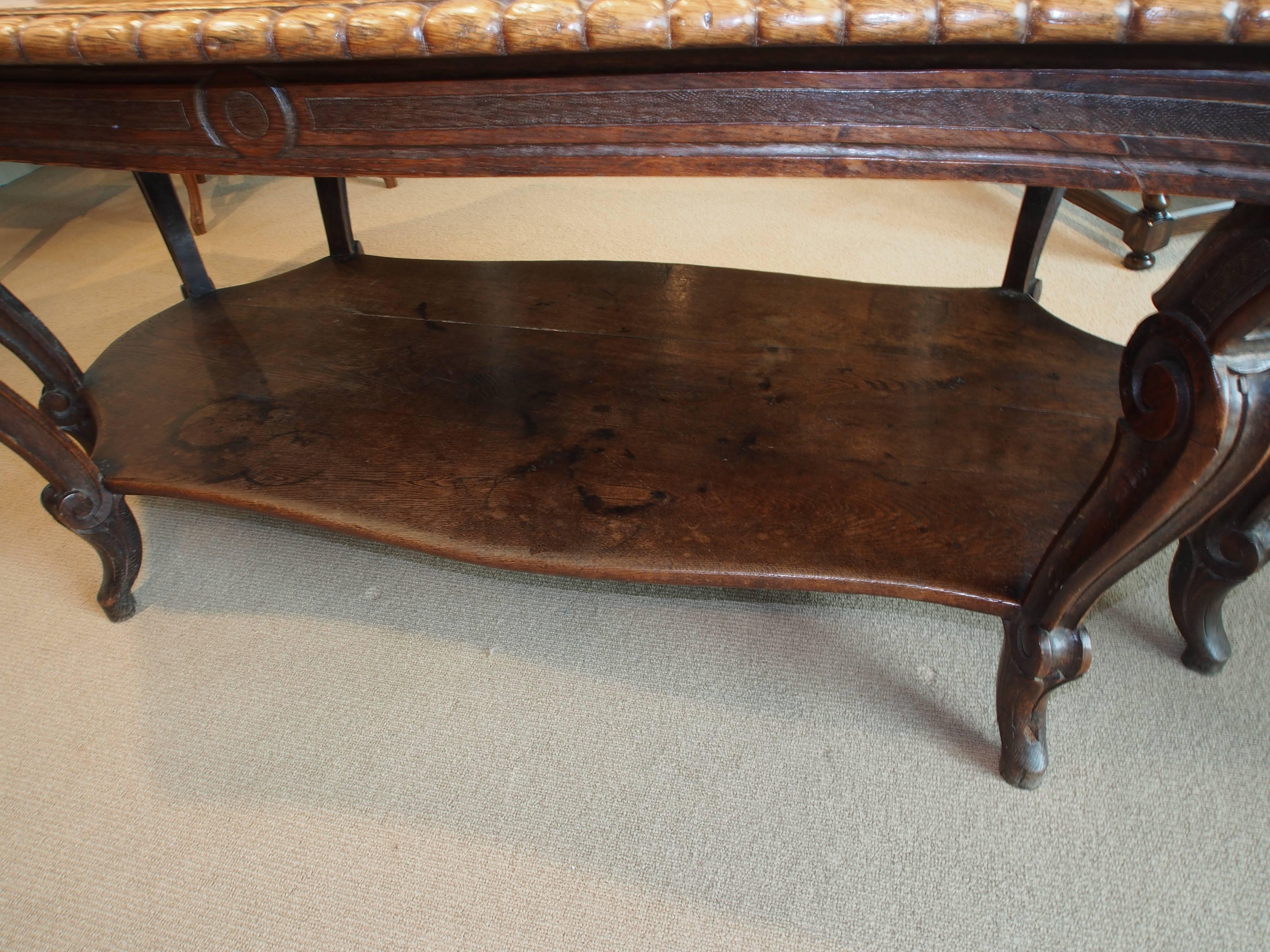 Italian Walnut Carved Table, 19th Century, with 8 Curved Legs and Low Shelf For Sale 1
