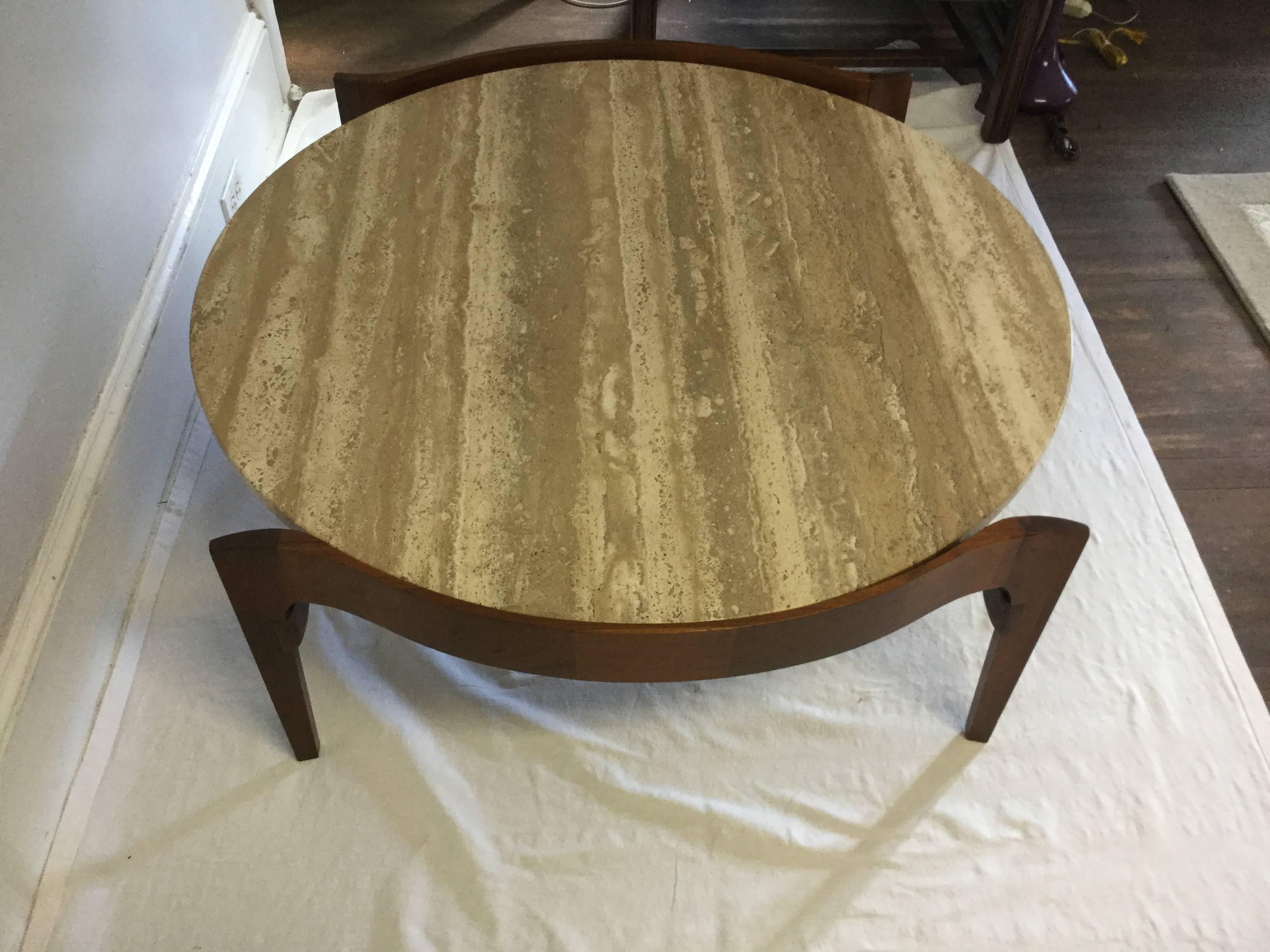 Beautiful mid century modern table by Berths Shaefer for Gordon International.
A Lovery round travertine top gently wrapped by a walnut frame.
2 available. 