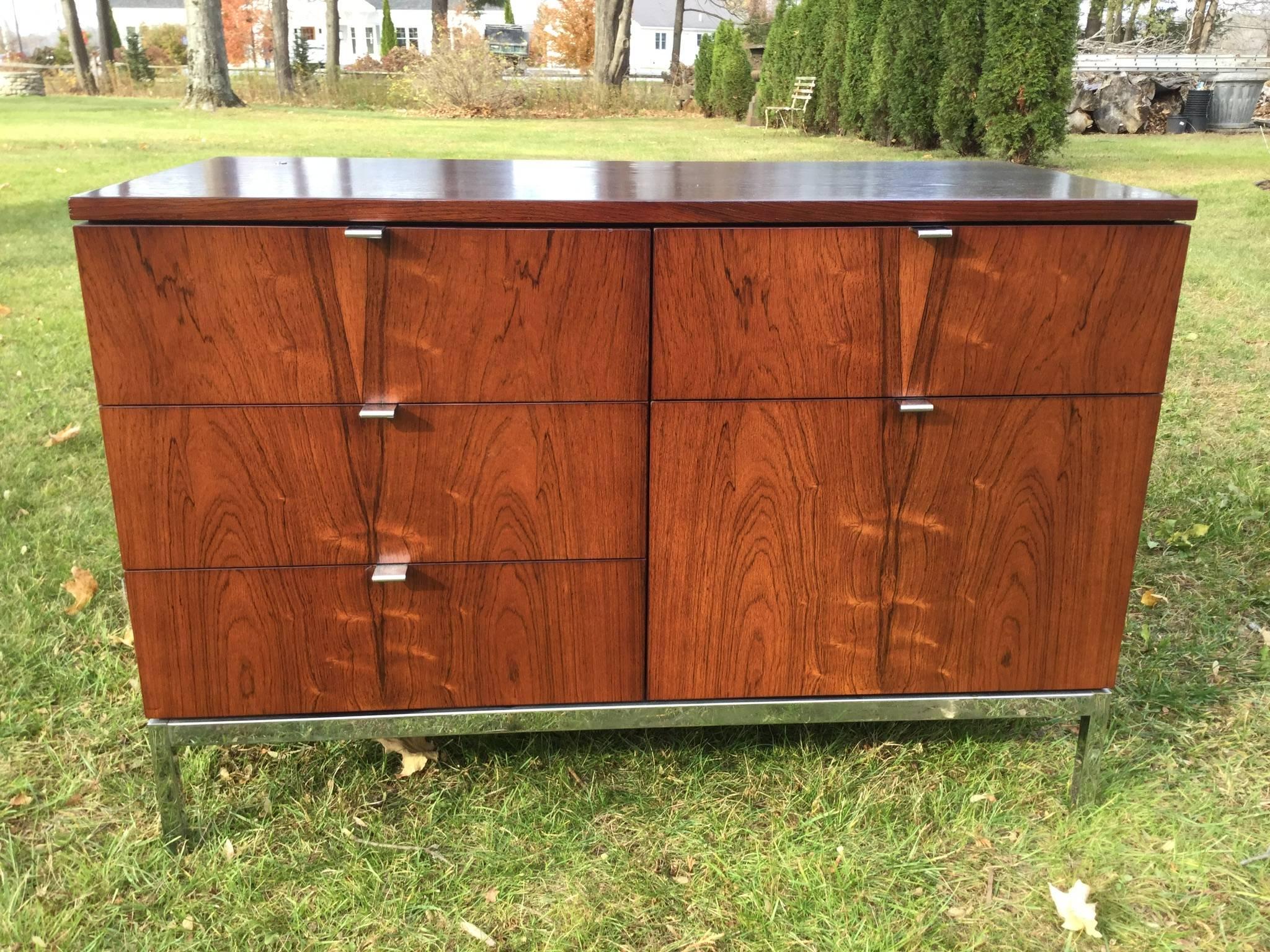 Another stunning find. Part of a three-piece office suite.
This cabinet has beautiful rosewood on all four sides. It can float in a room and be admired from any view.
The matching larger credenza and eight foot oval rosewood table are available in