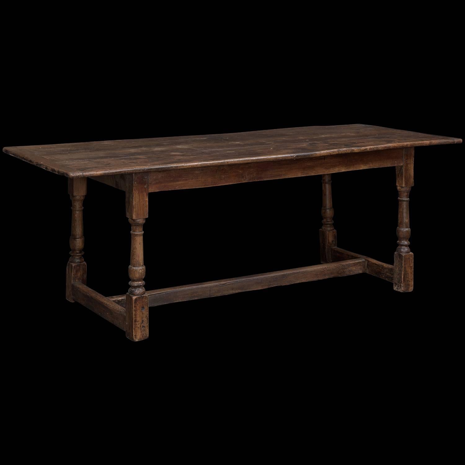 Elmwood dining table. Authentic primitive construction with turned legs and bottom stretcher.