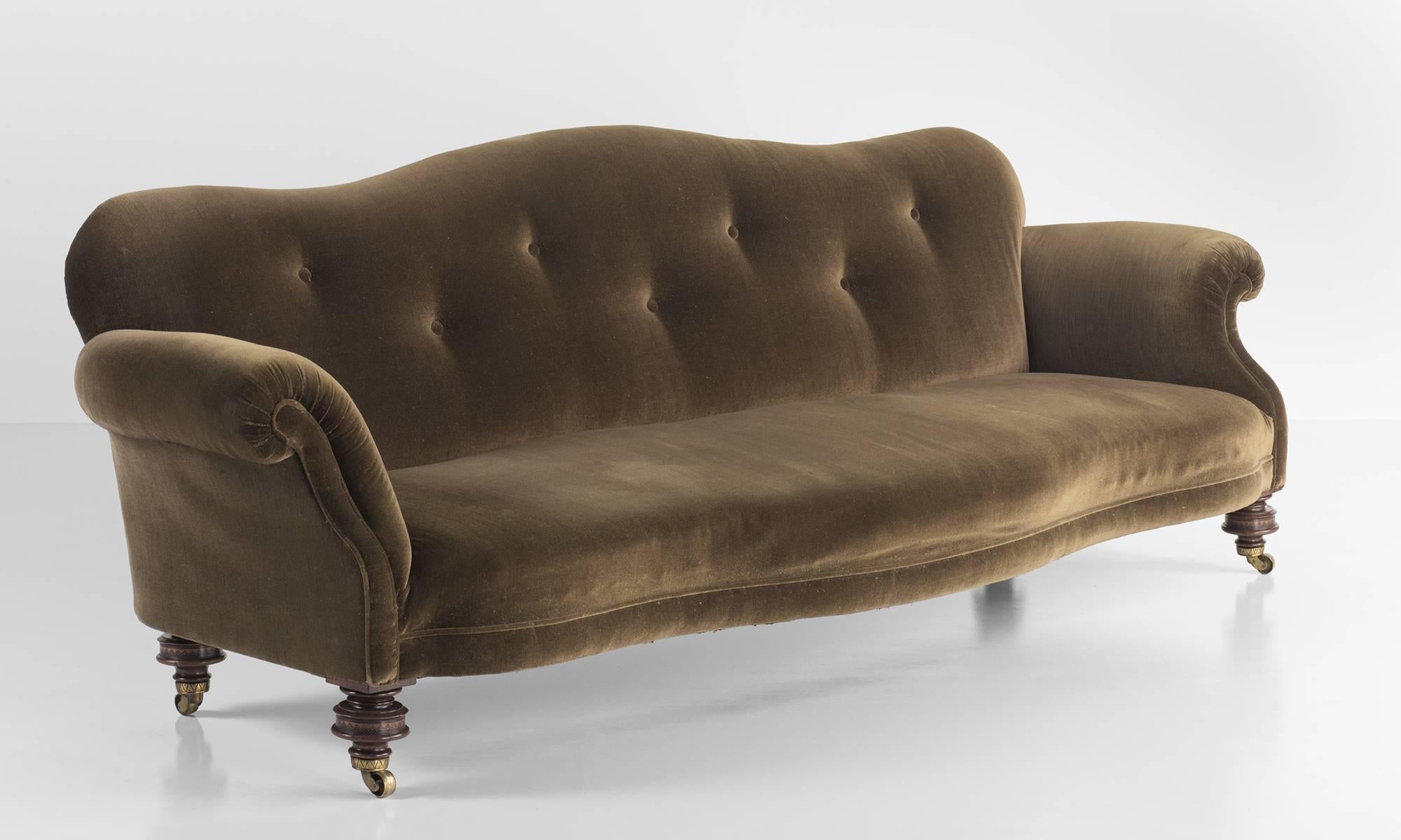 Victorian velvet and Mahogany sofa, circa 1890.

Grand scale country house sofa with original velvet upholstery and turned mahogany legs. With brass castors.

Originally purchased from an estate in Suffolk.